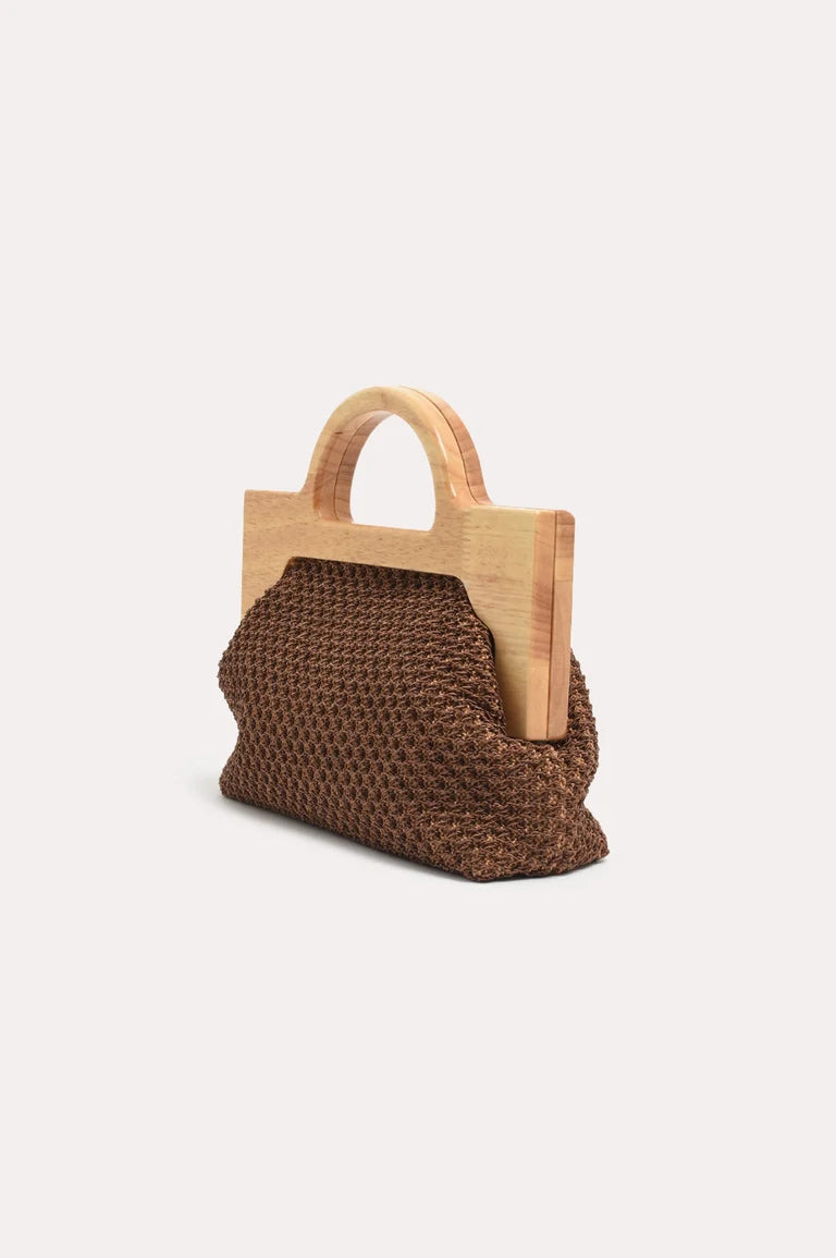Adorne brown woven handbag with wooden handles on a white background