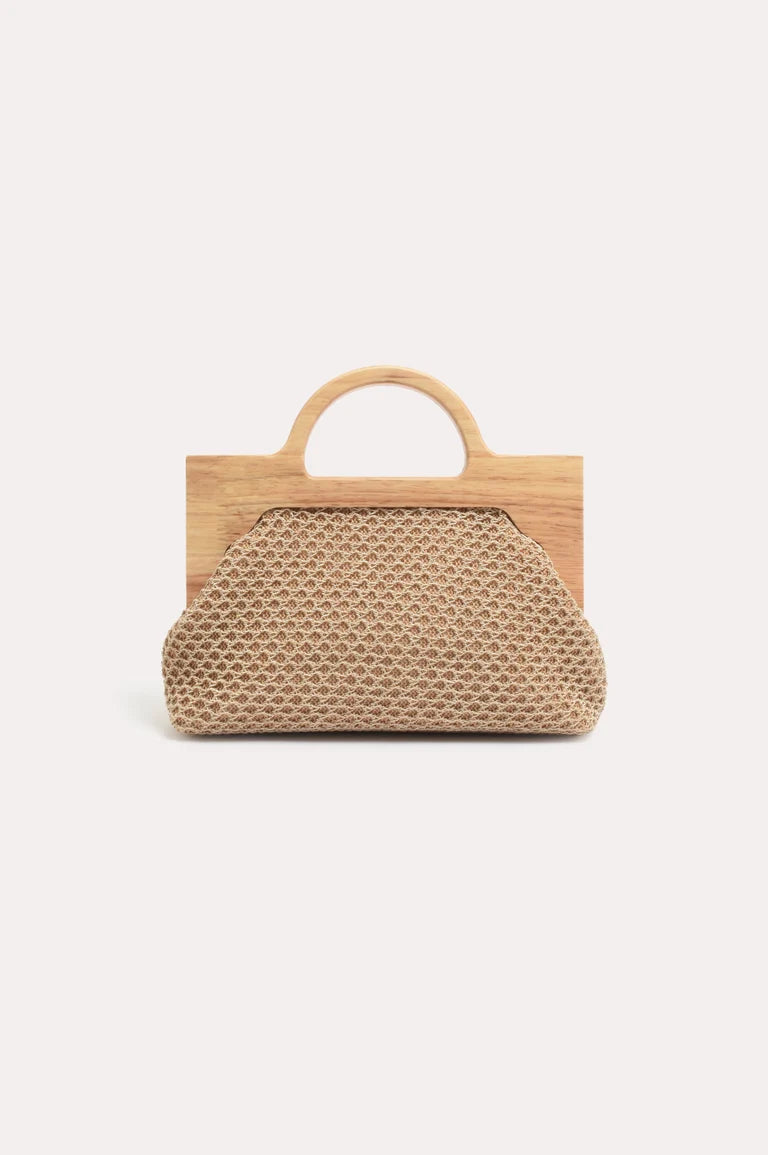 Image of A structured handbag with a Adorne woven beige front panel and a light natural wood handle and backboard, shown against a plain off-white background.