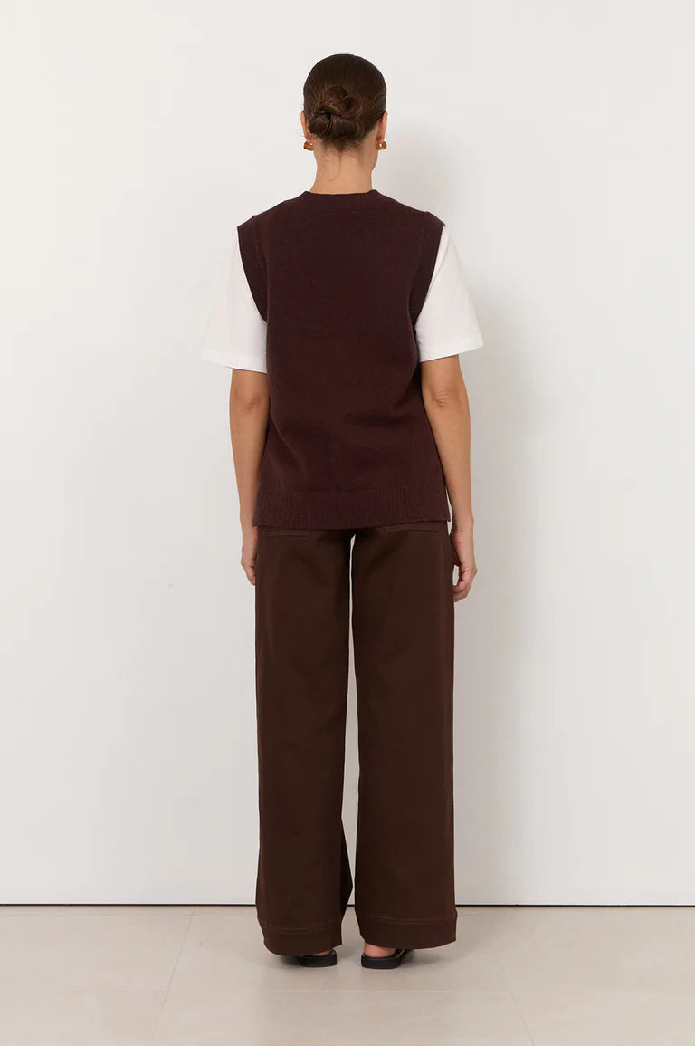 Image of Woman wearing a Adorne brown vest and wide-leg pants against a white background