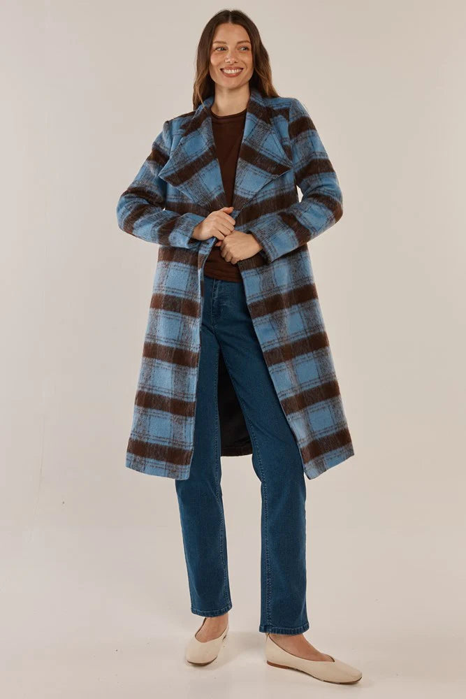Image of Woman wearing a Betty Basics blue and brown plaid coat on a plain background