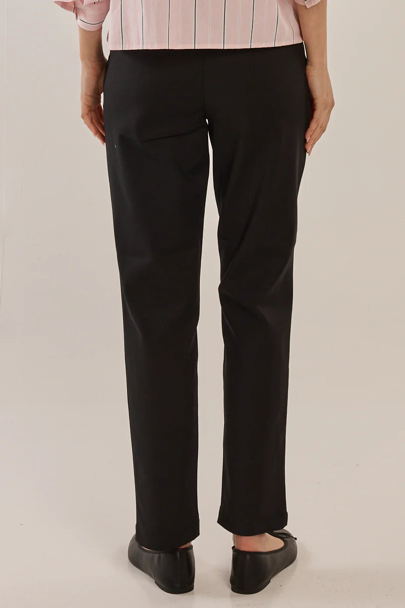 Image of Woman wearing Betty Basics black pants on a plain background