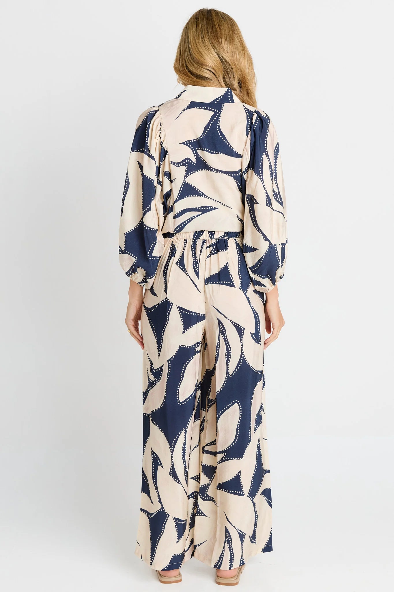 Image of Woman wearing a long, Betty Basics patterned with a white background