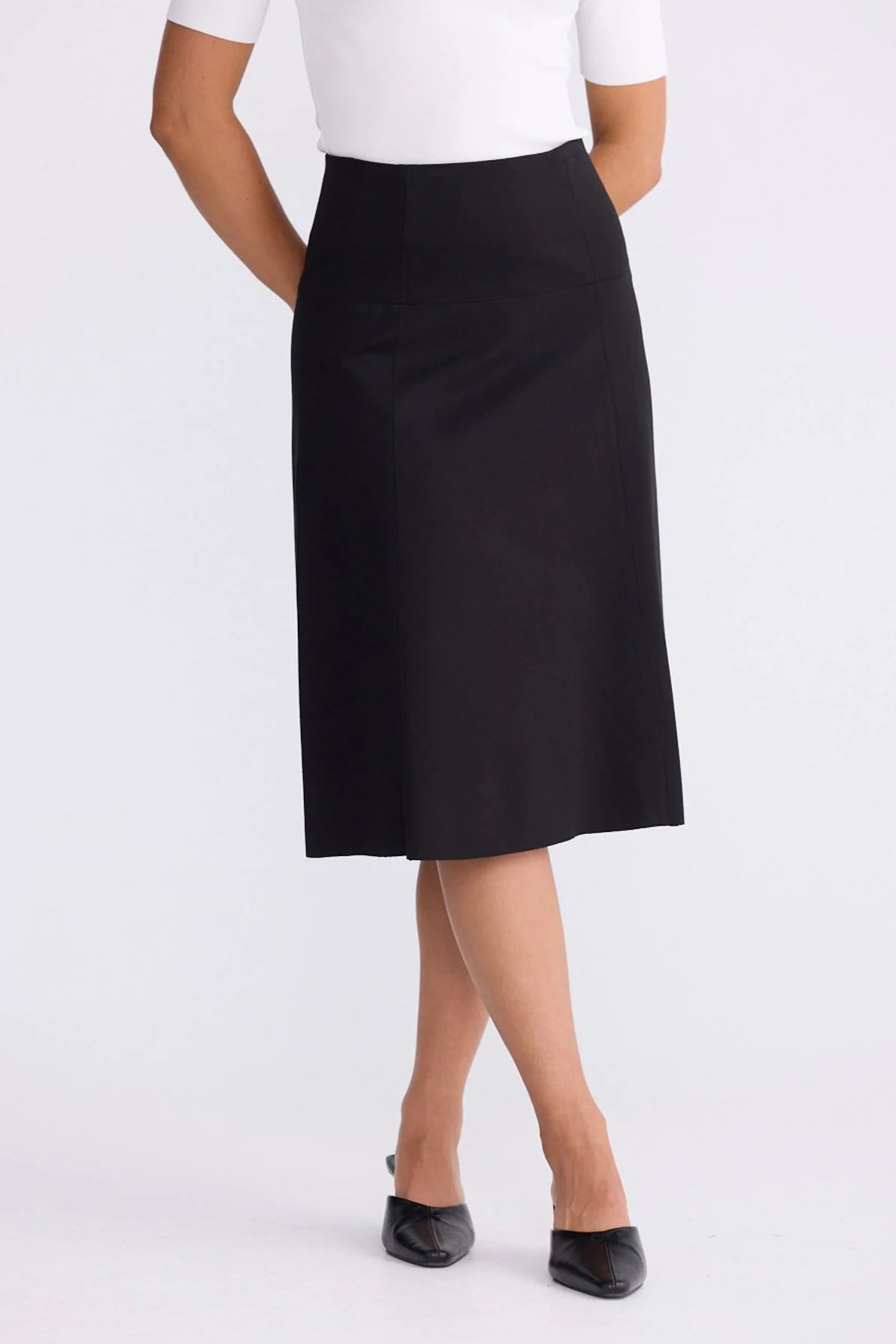 Woman wearing a Brave & True black skirt on a white background