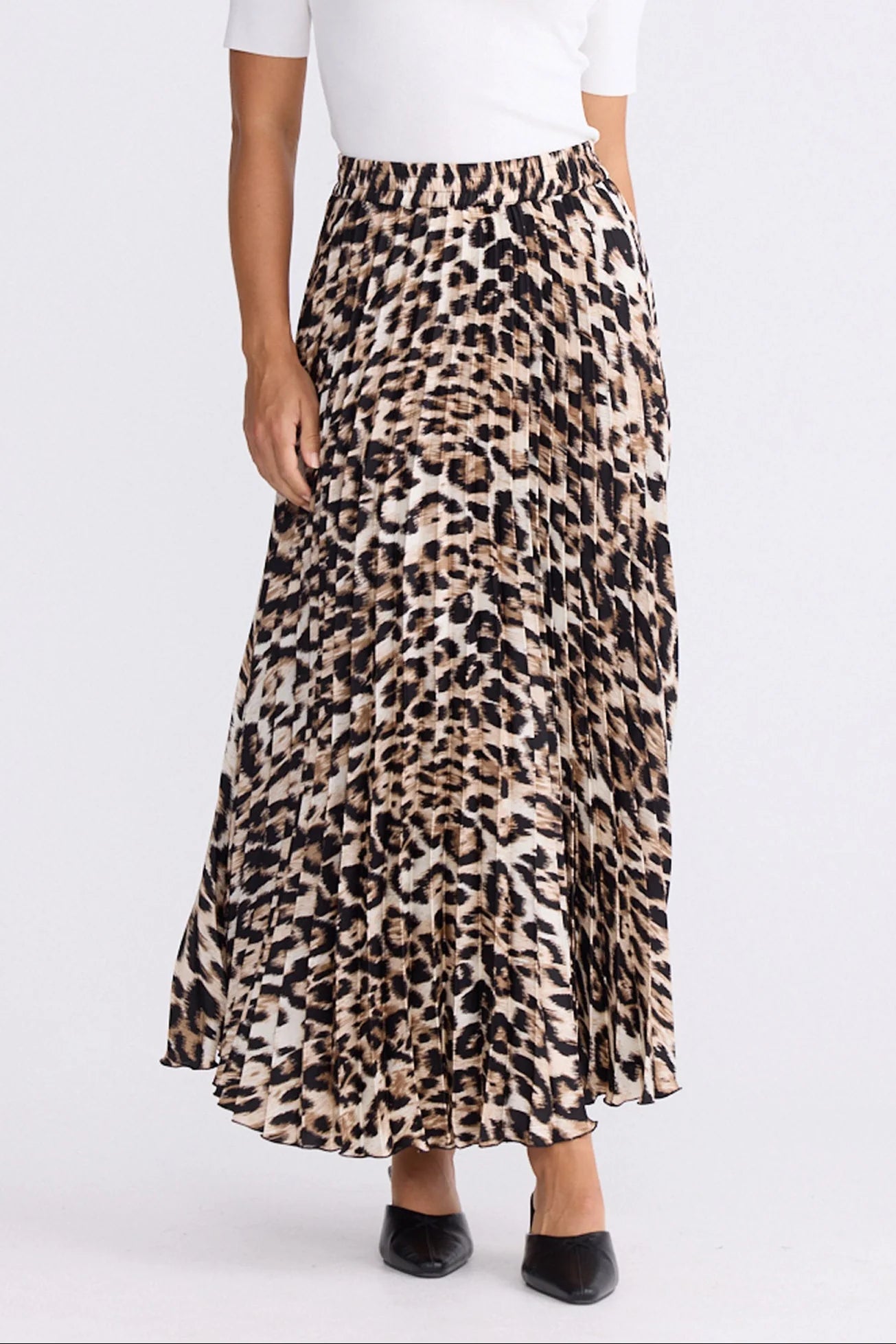 Image of Woman wearing a Brave and True leopard print skirt on a white background
