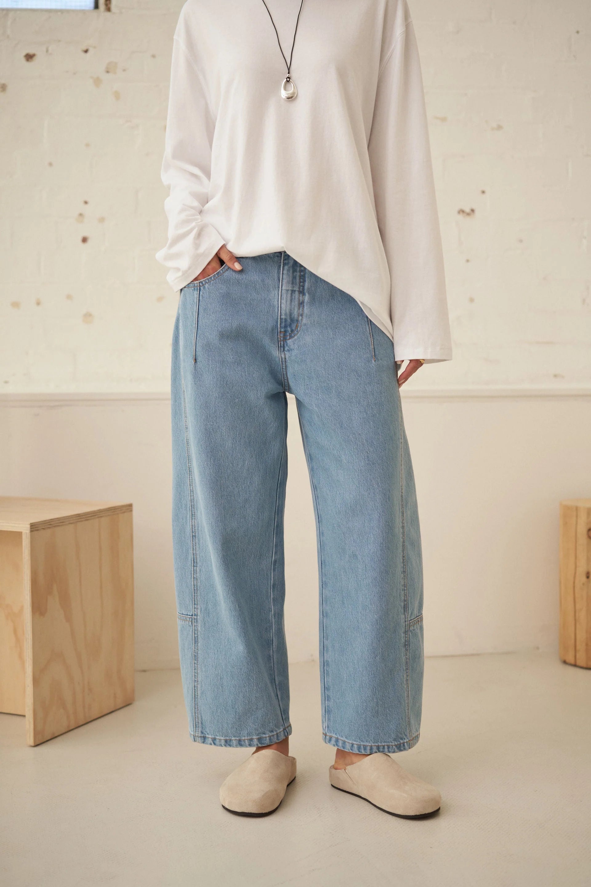 Image of Ceres Life Demi Barrel Jeans in Vintage Blue, featuring a high-waisted silhouette, relaxed curved barrel legs, classic button and zip fastening, front pockets and a cropped ankle-length finish.