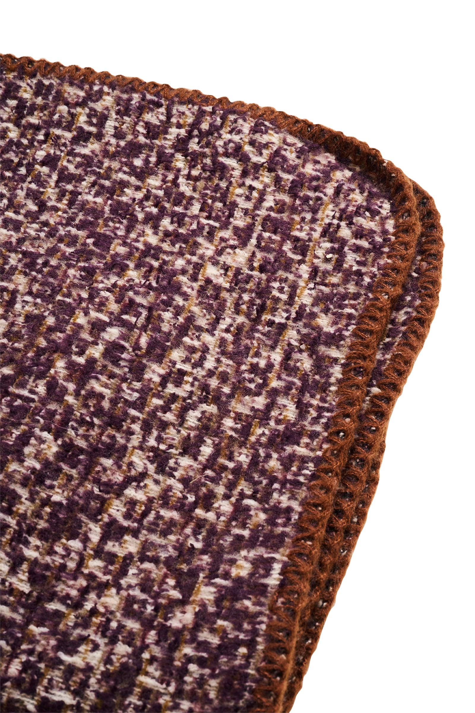 Image of Eb & Ive scarf Close-up of a textured purple and brown corner