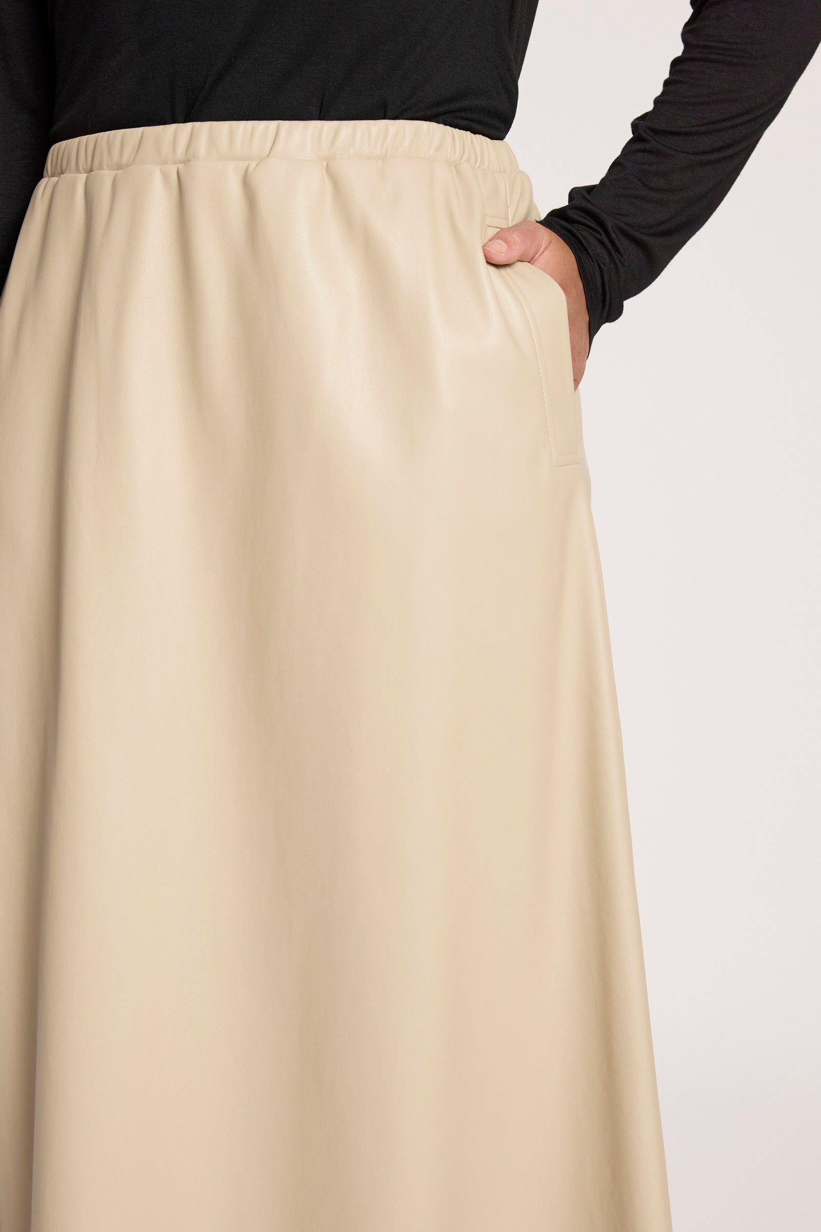Image of Eb & Ive Beige skirt worn by a Woman on a plain background
