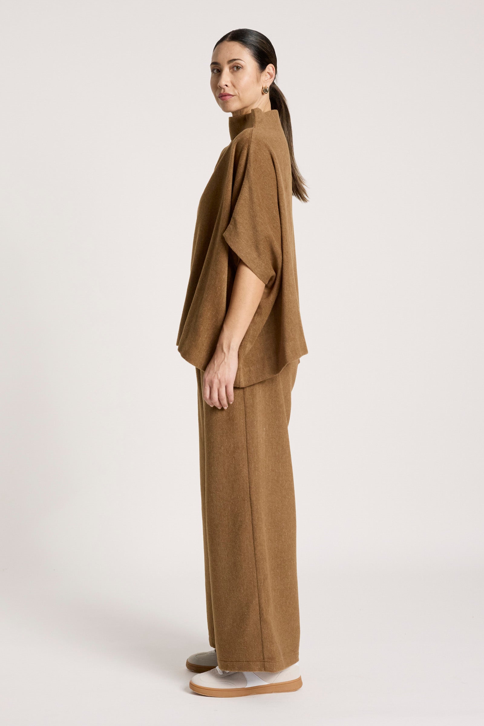 Image of Woman wearing a Eb & Ive brown outfit on a white background