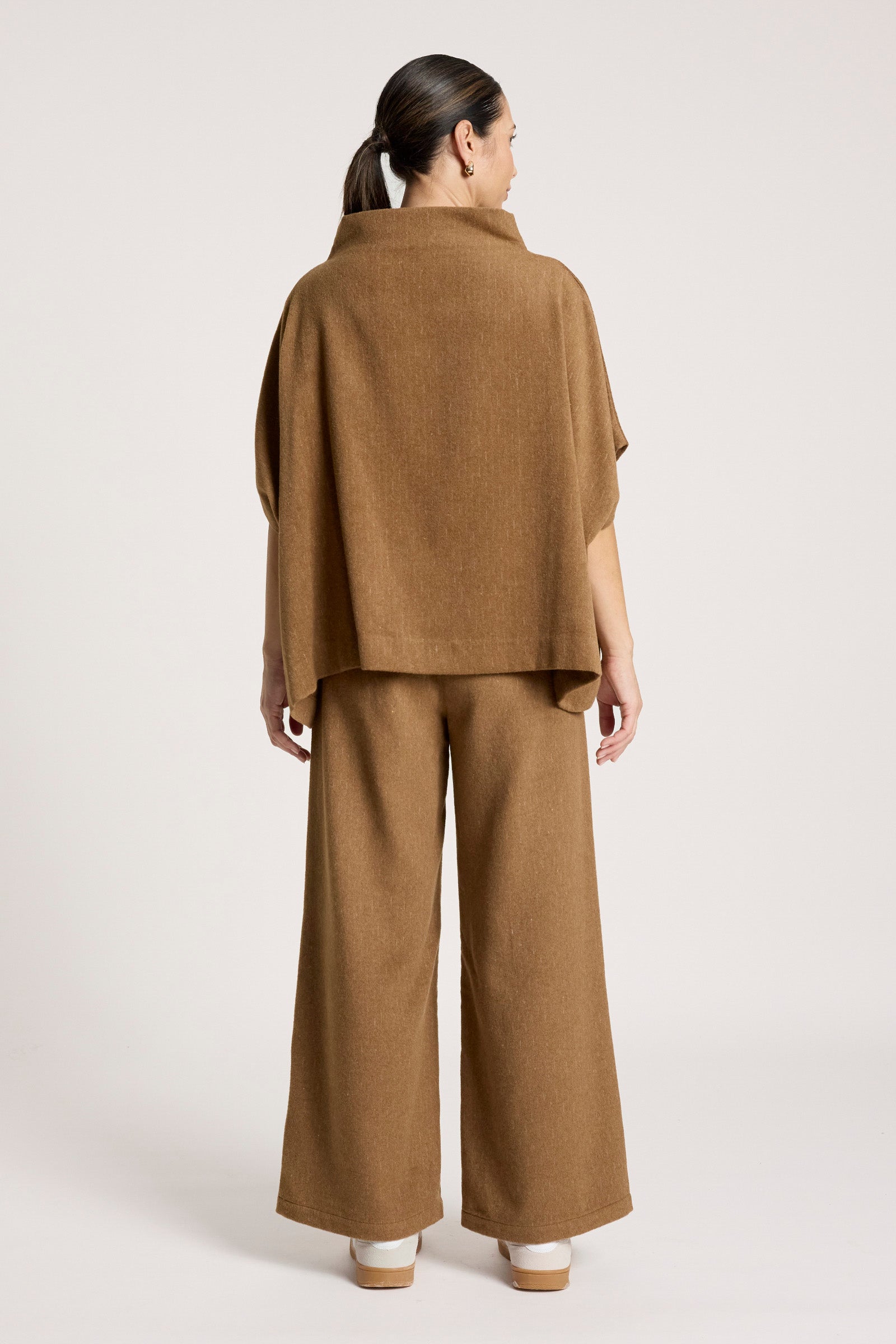 Image of Woman wearing a Eb & Ive brown outfit with wide-leg pants on a white background