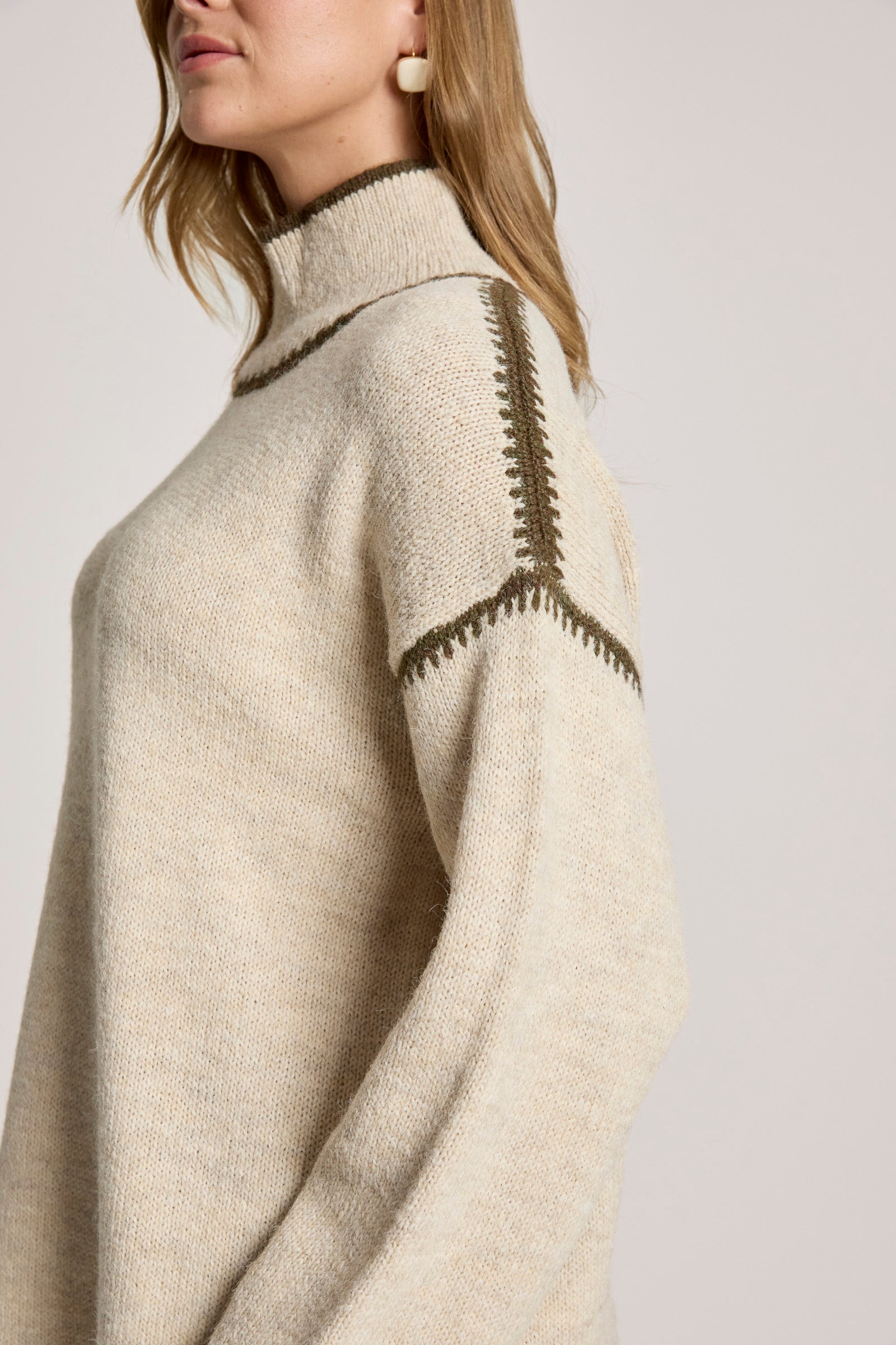 Image of Eb & Ive Beige sweater with intricate black pattern on a plain background