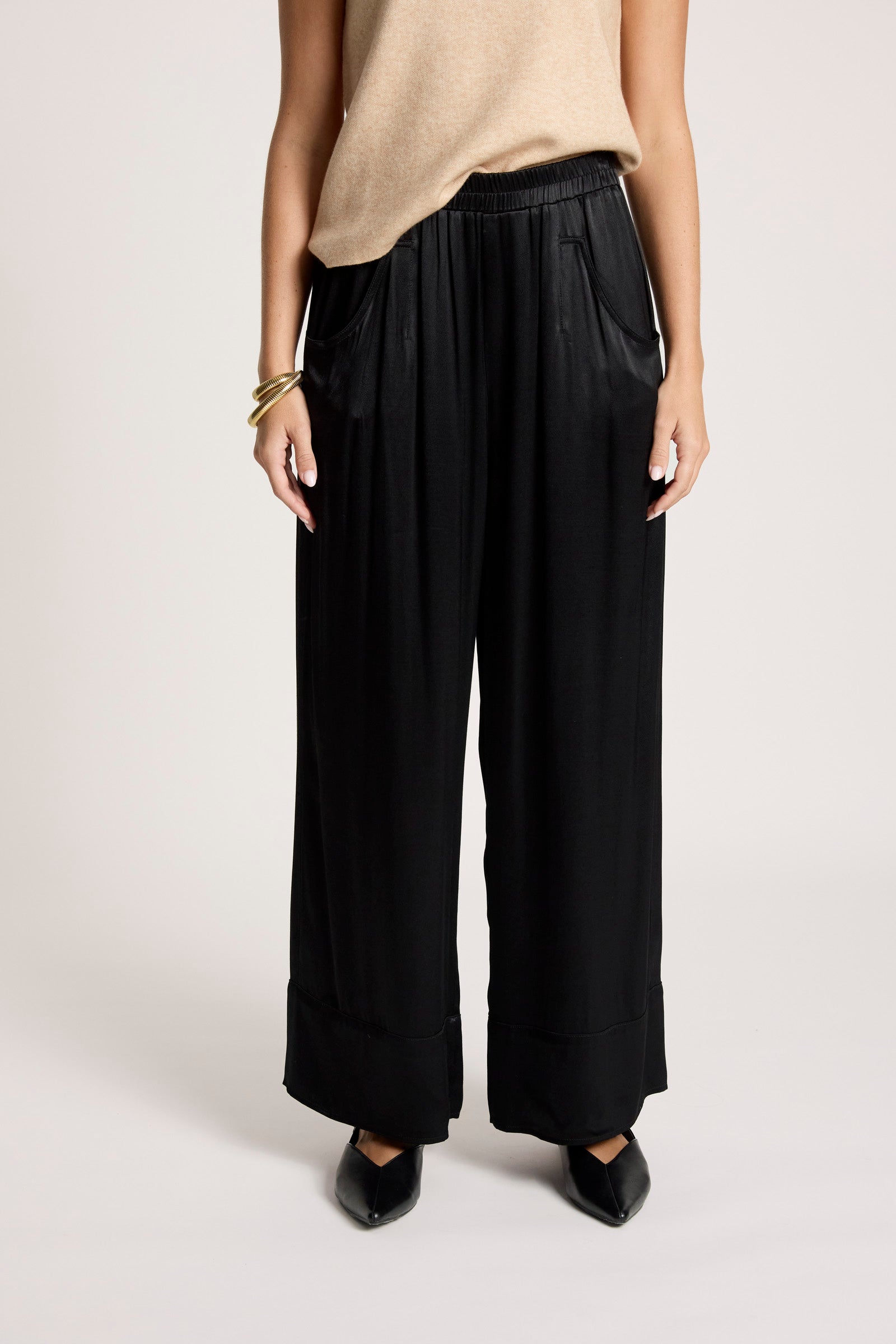 Image of Person wearing Eb & Ive black wide-leg pants on a plain background