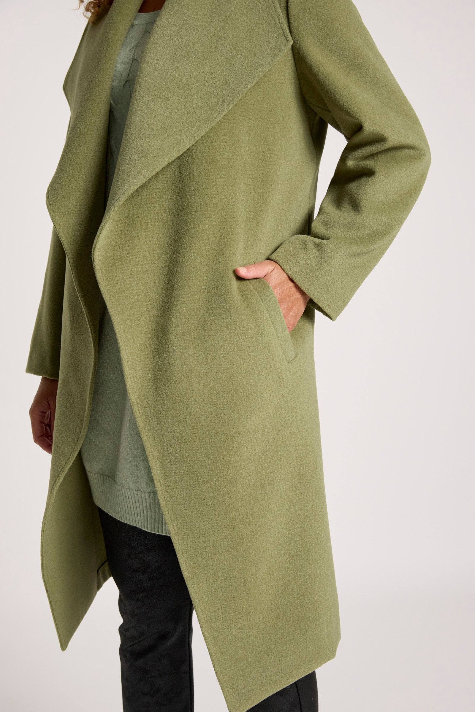 Eb & Ive Green cardigan worn by a person on a white background