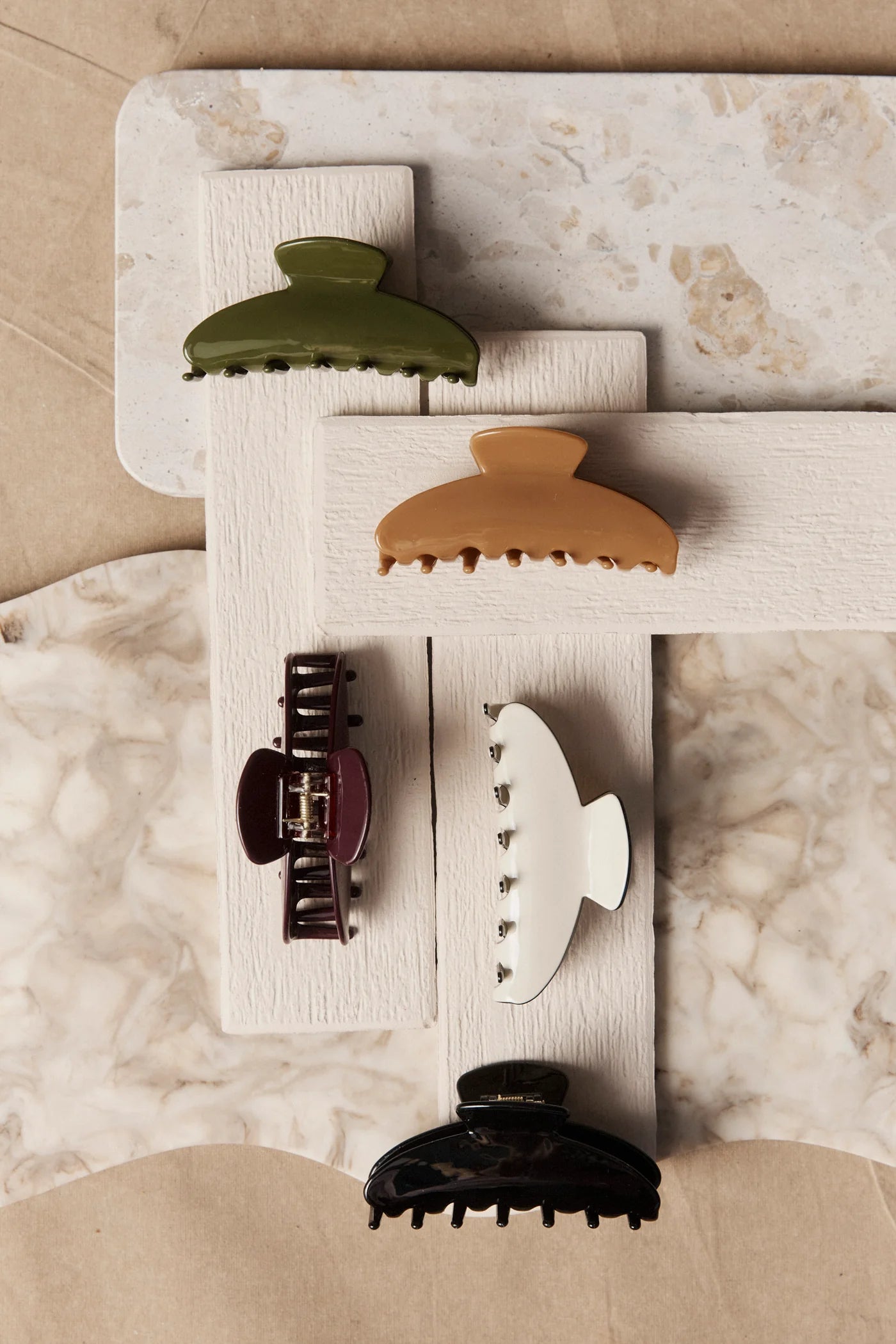 Set of Eb & Ive hair clips on a marble surface