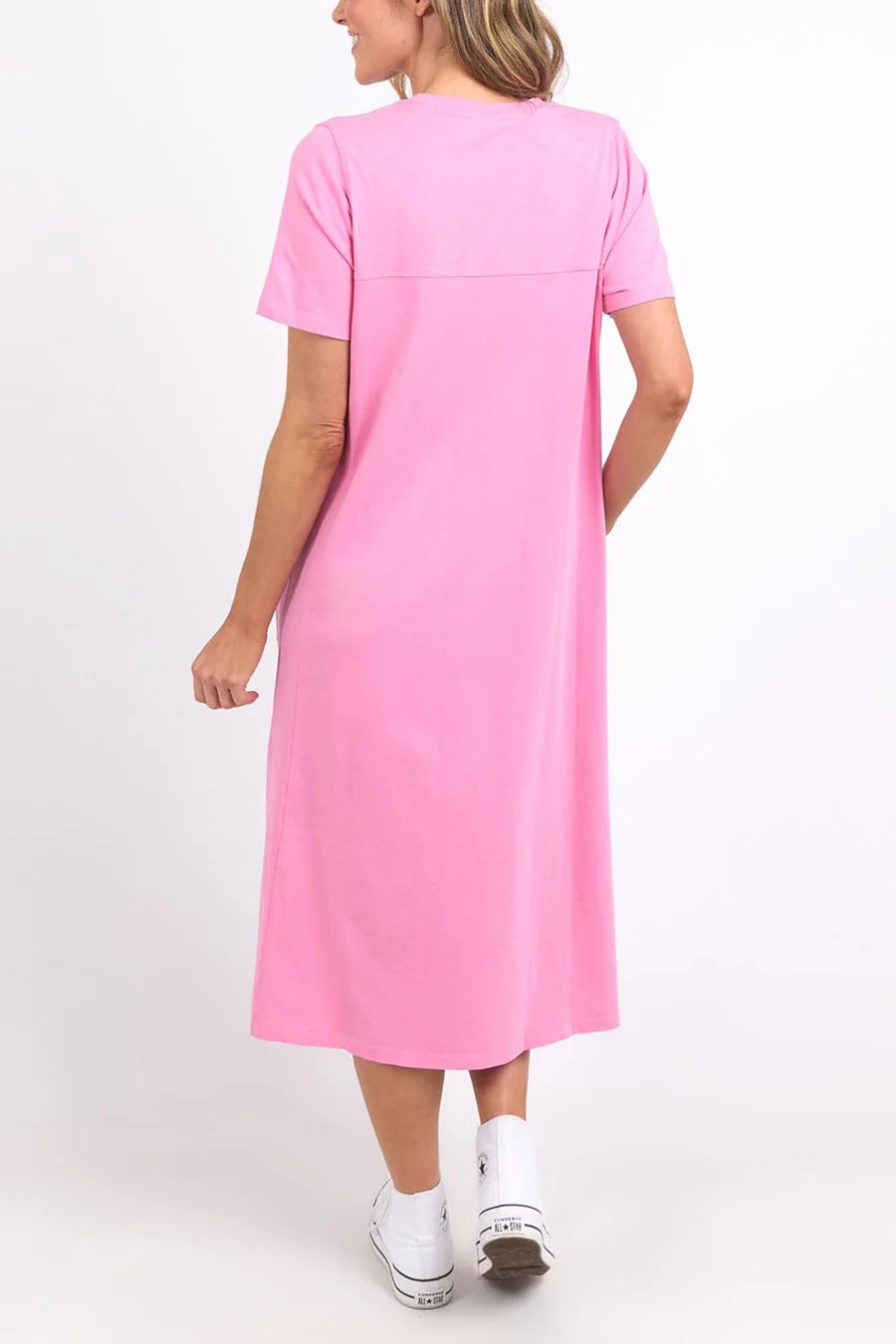 Image of Woman wearing a Elm pink dress on a white background