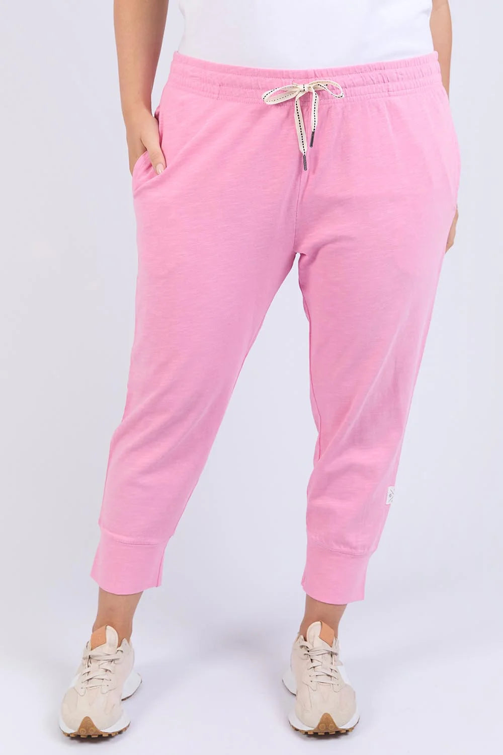 Image of Woman wearing Elm pink sweatpants on a white background