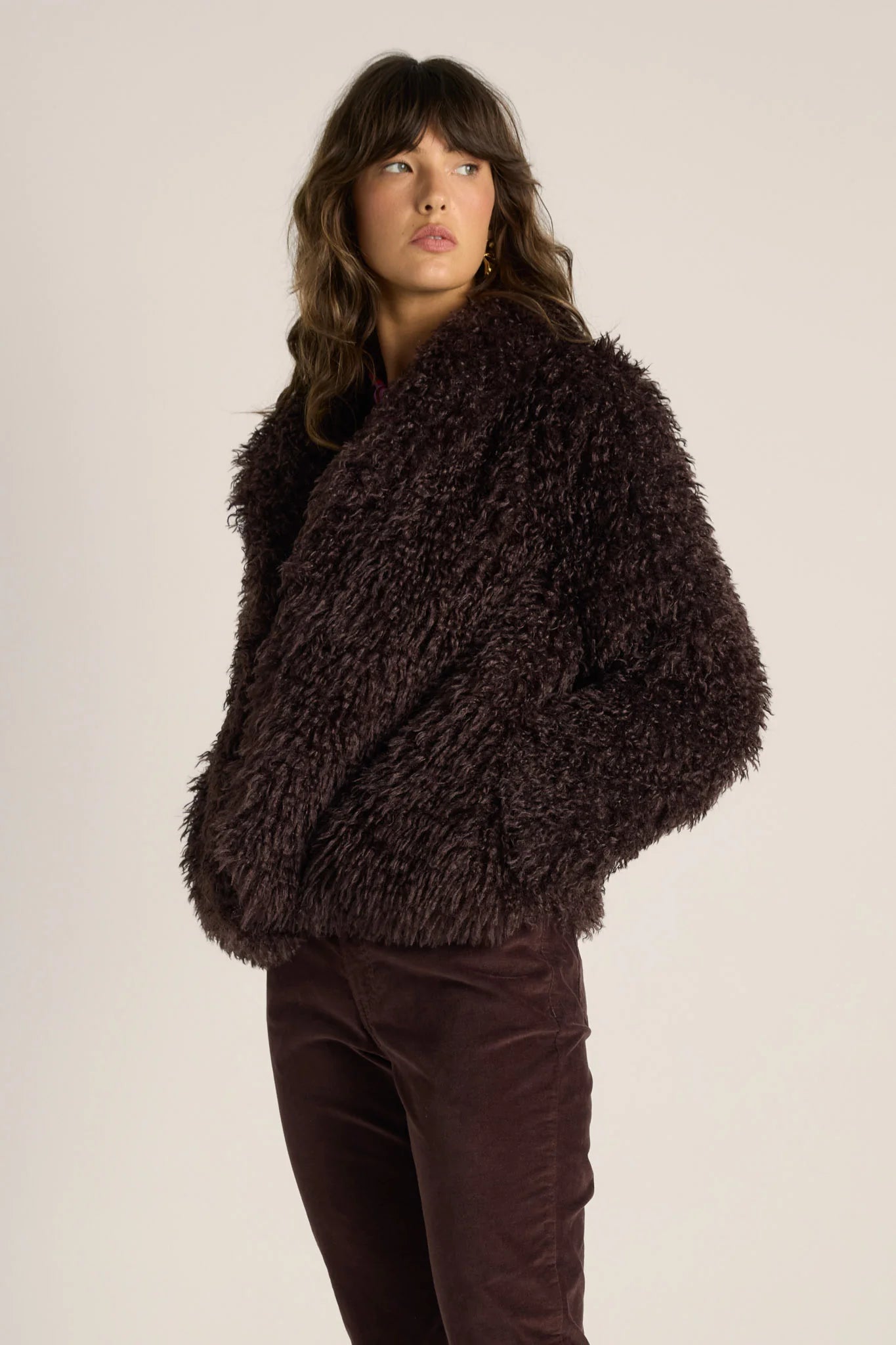 Image of Woman wearing a Fate & Becker brown fuzzy sweater against a plain background