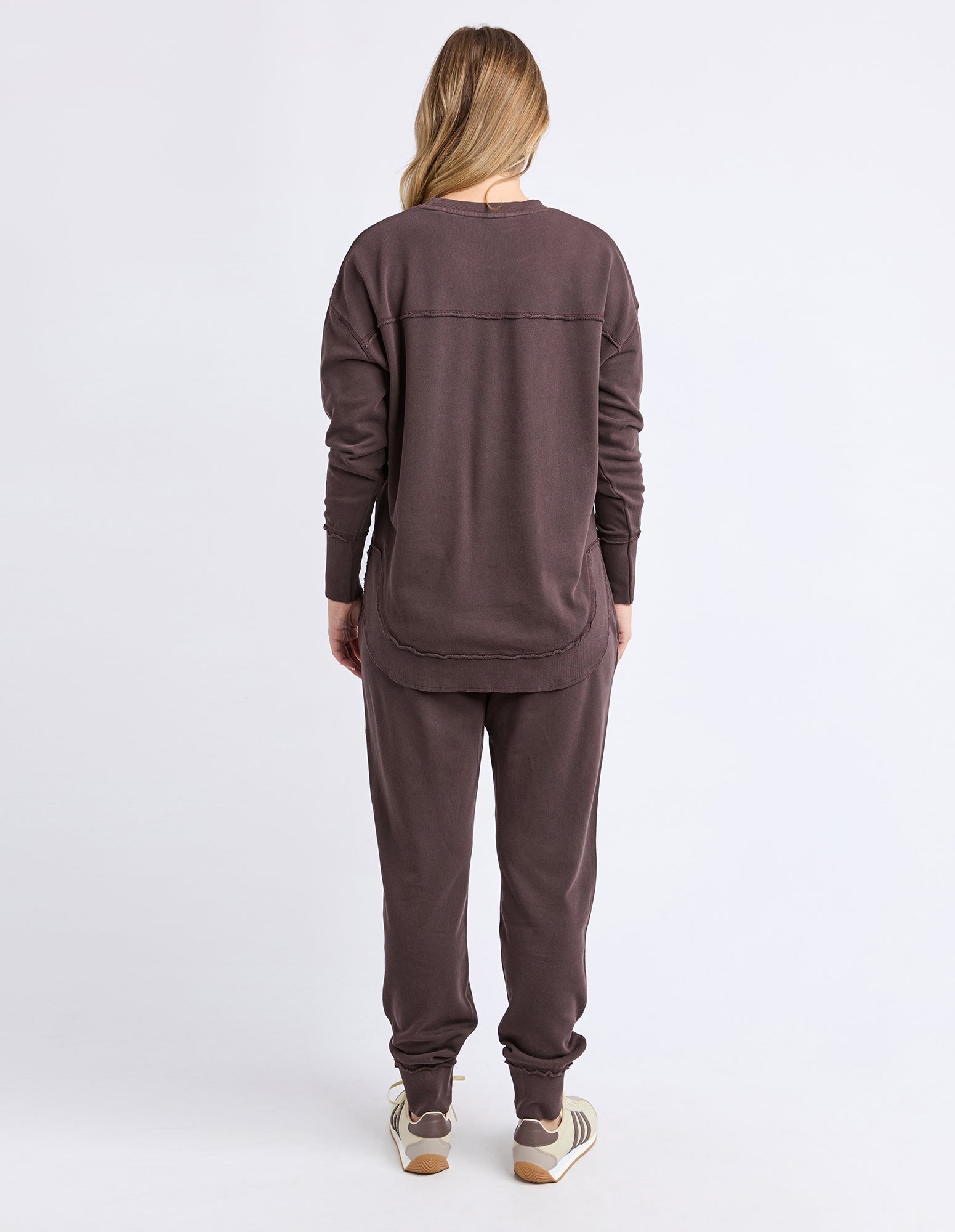 Collection of Woman wearing a brown Foxwood tracksuit on a white background in a gallery layout