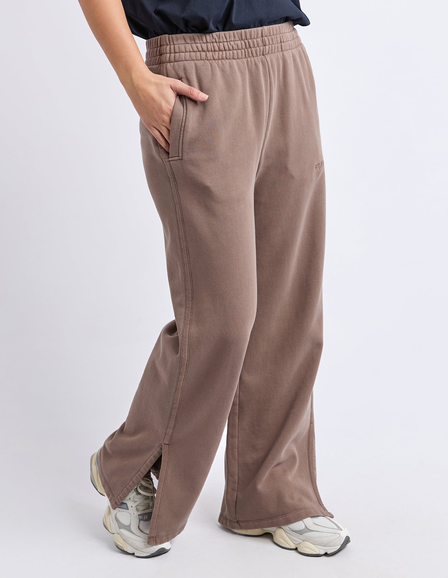 Image of Women wearing Foxwood brown pants on a white background
