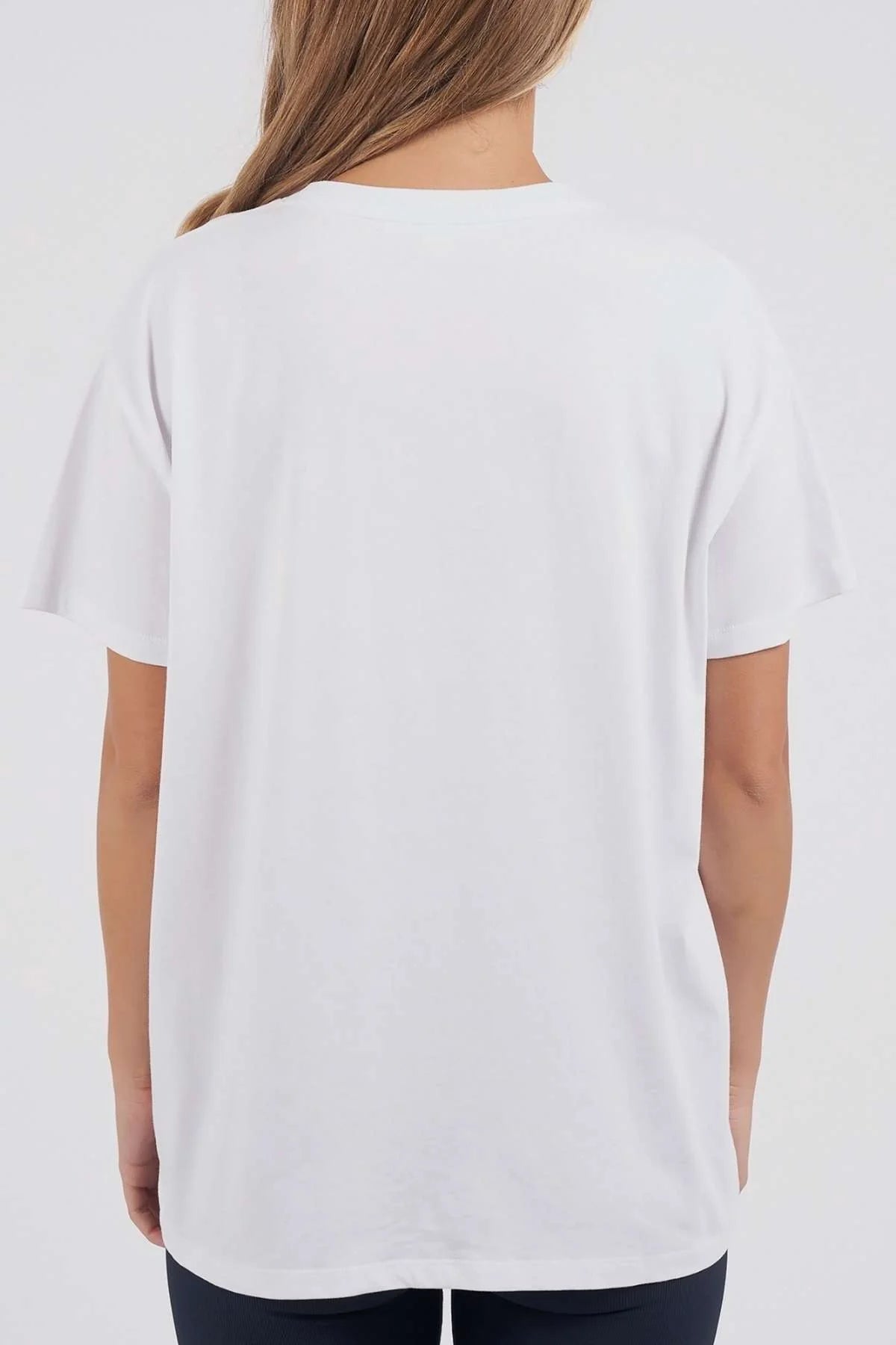 Image of A woman viewed from the back wearing a plain Foxwood white short-sleeve crewneck T-shirt against a light gray studio background.