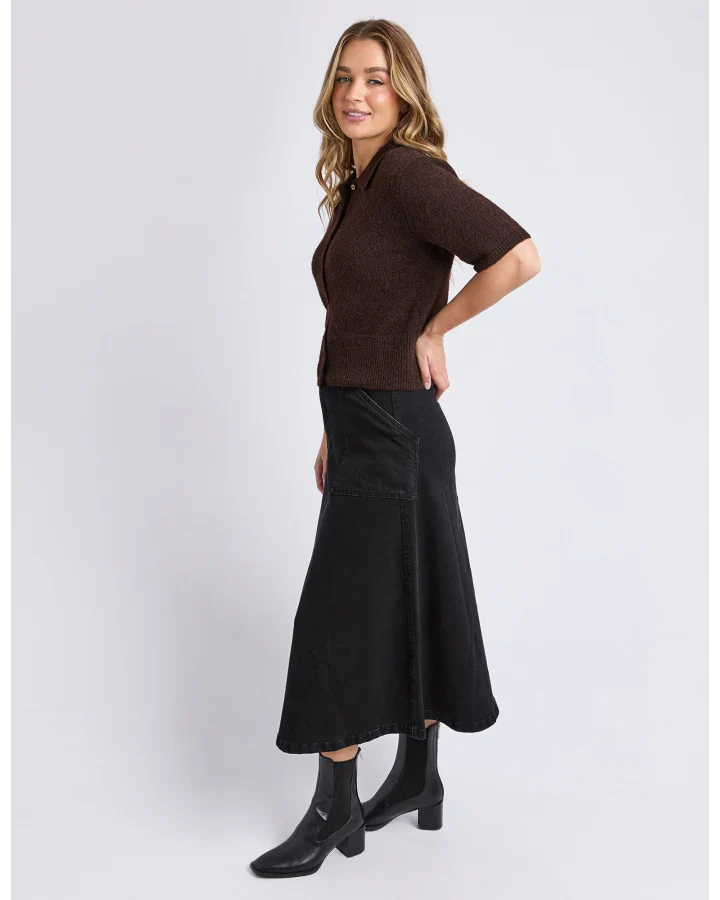 Image of Woman wearing a Foxwood brown top and black skirt on a white background