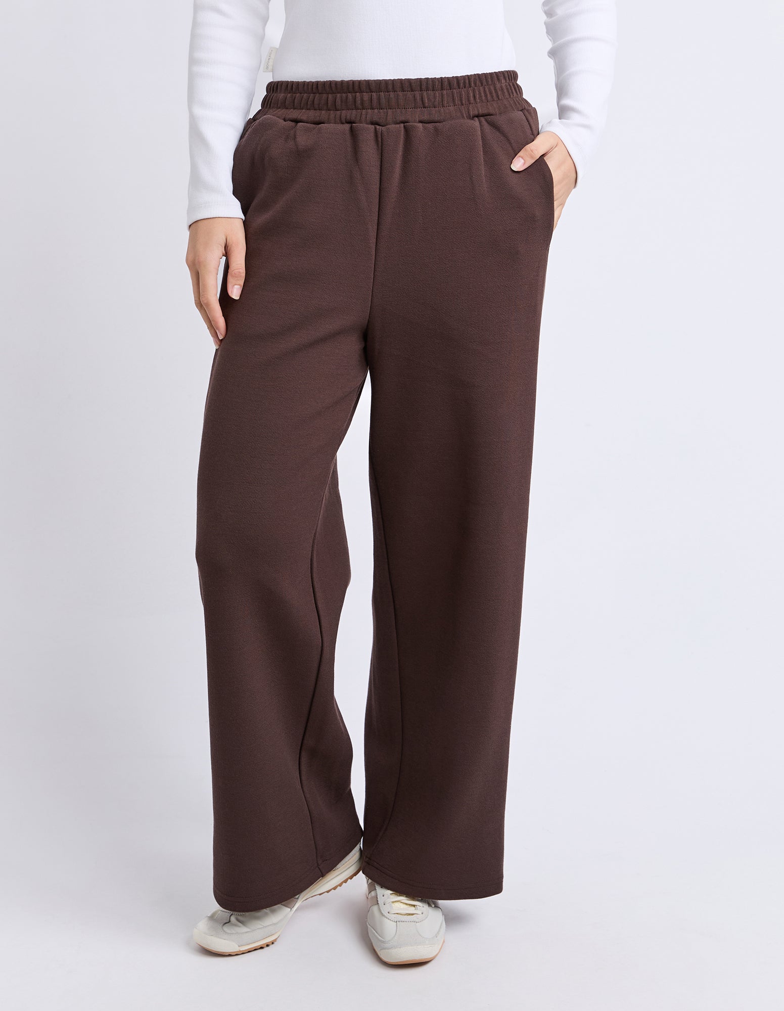 Image of Woman wearing Foxwood Brown wide-leg pants worn by a person on a white background