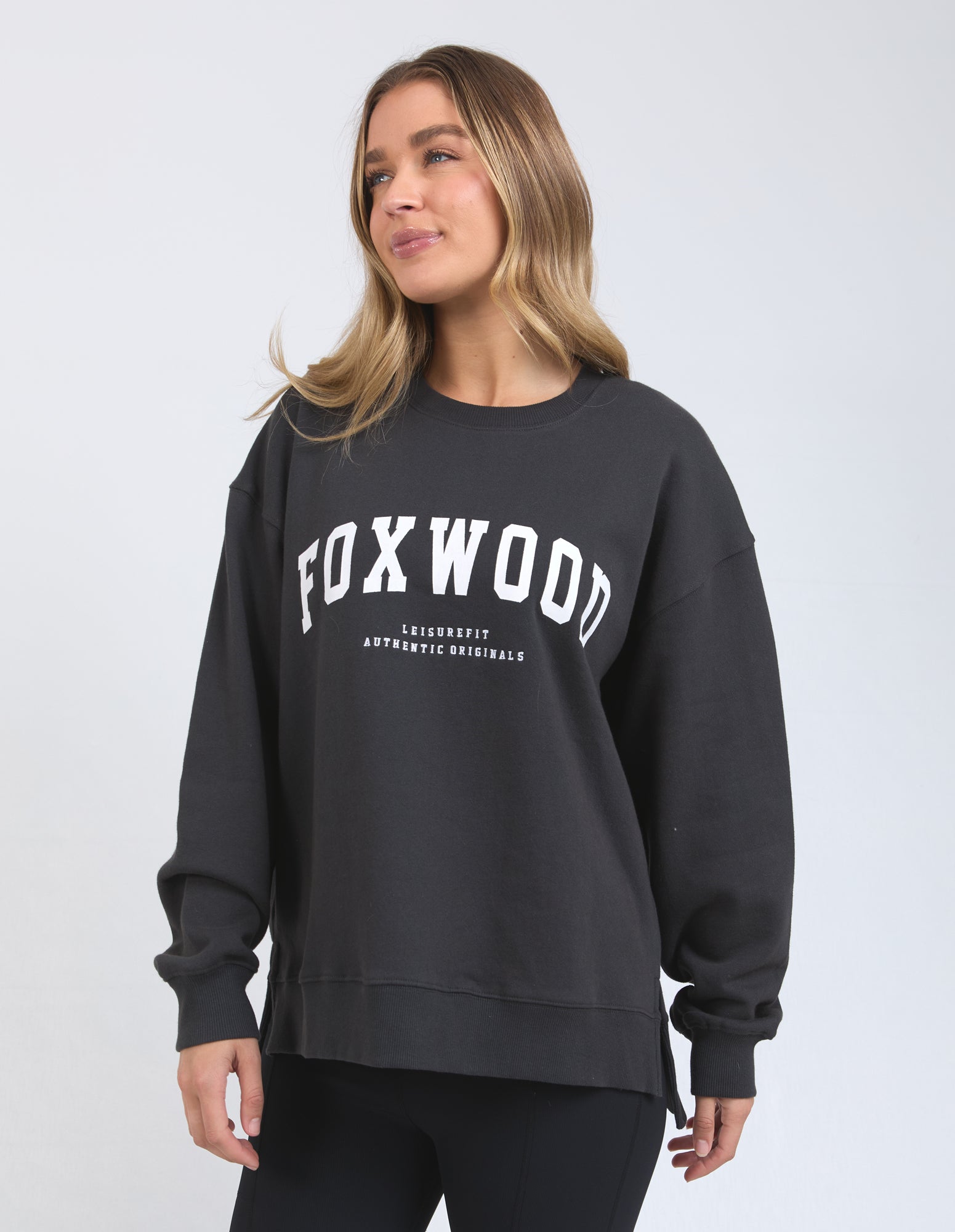 Image of Woman wearing Foxwood Interval crew on a white background