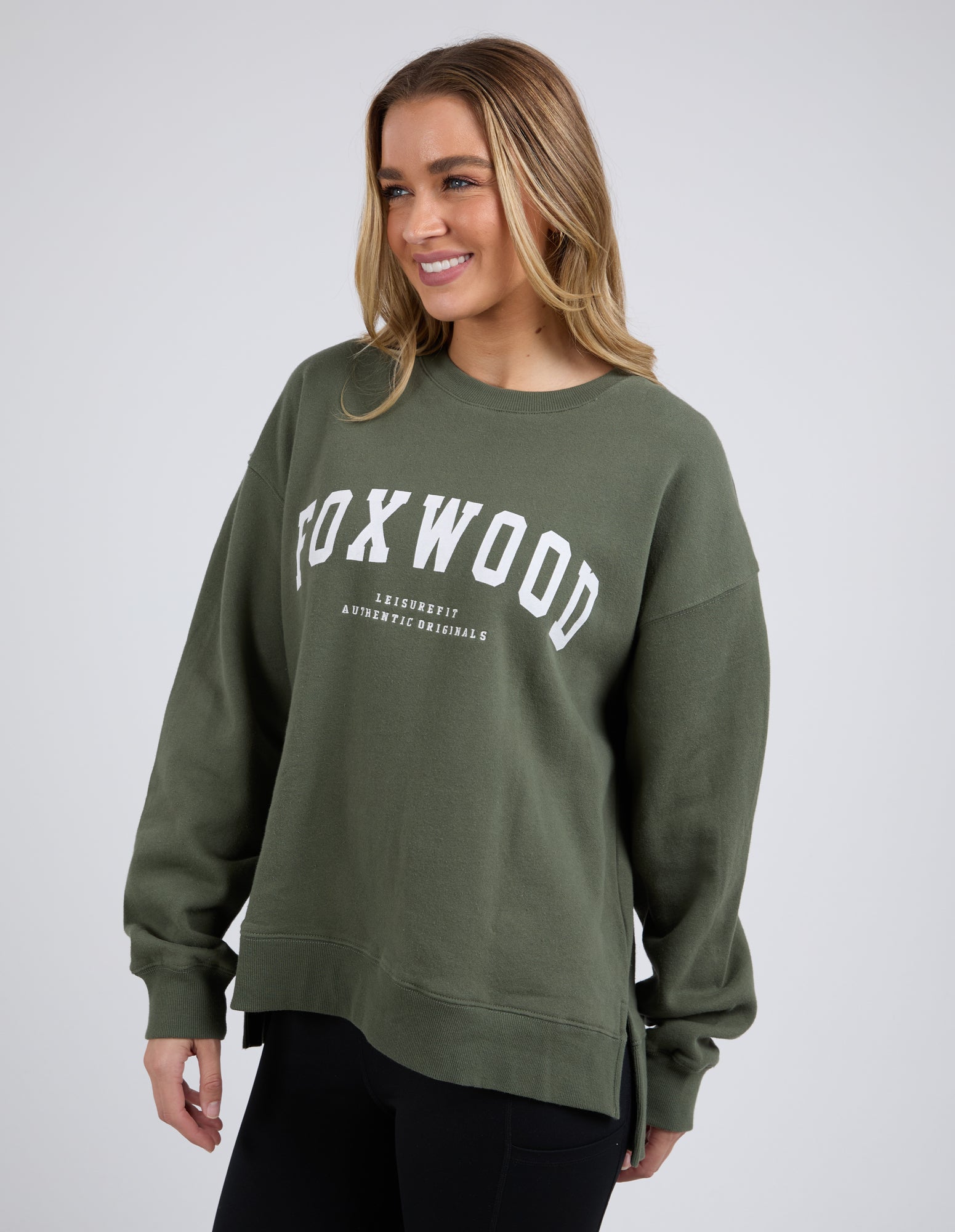 Image of Woman wearing Foxwood khaki crew on a white background