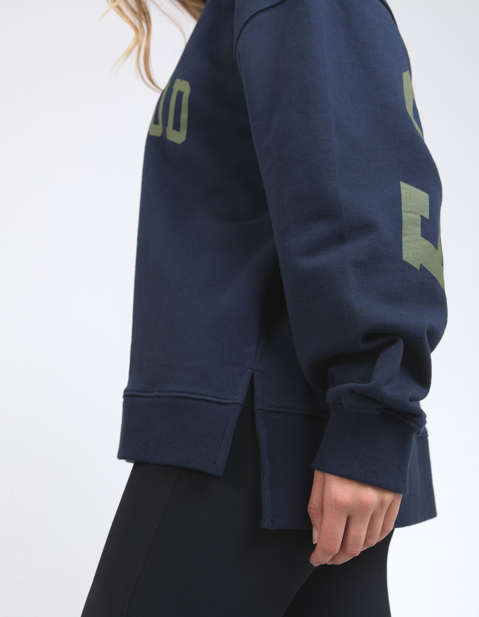 Navy blue sweatshirt with green text on a white background
