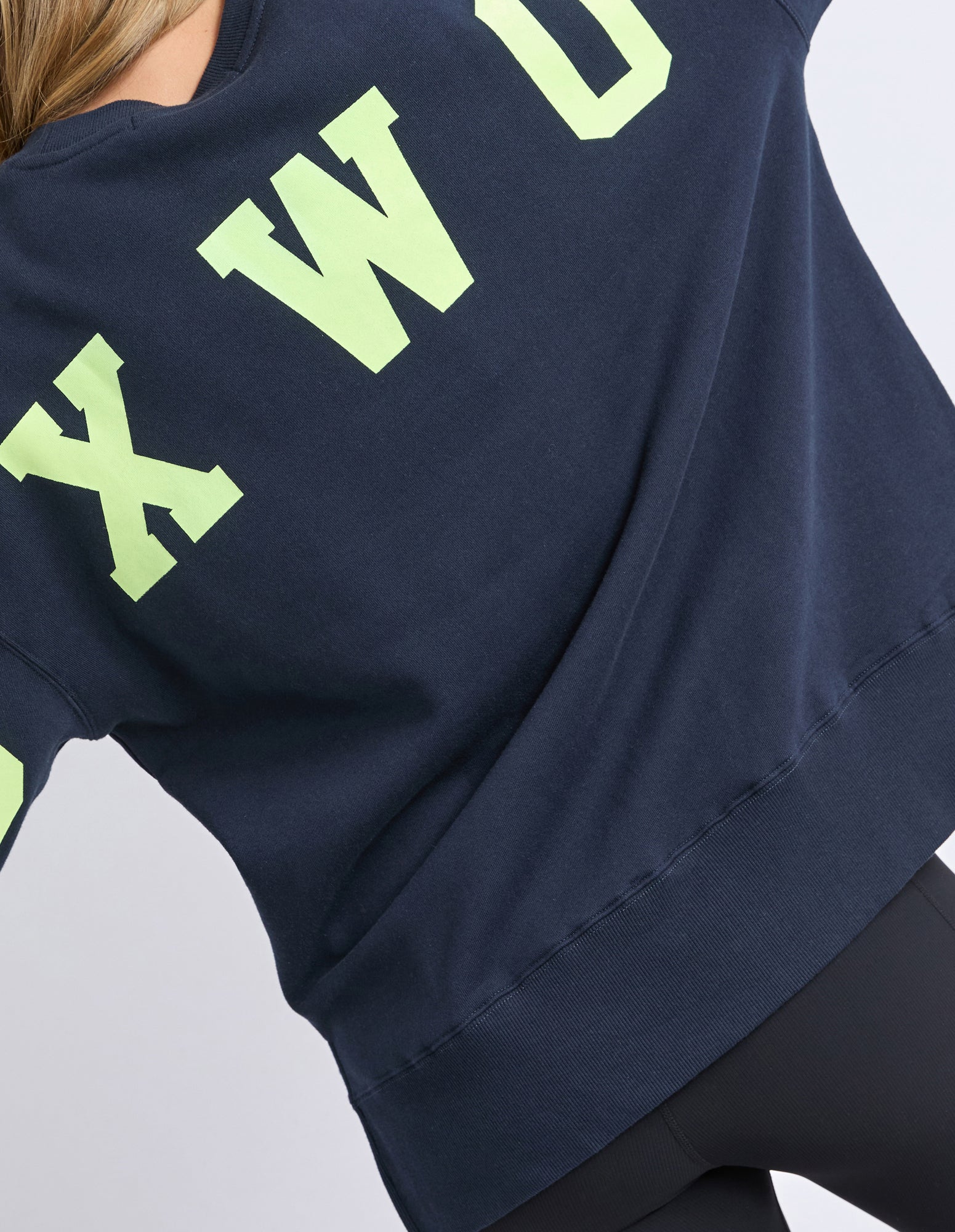 Foxwood navy blue sweatshirt with green text on a plain background