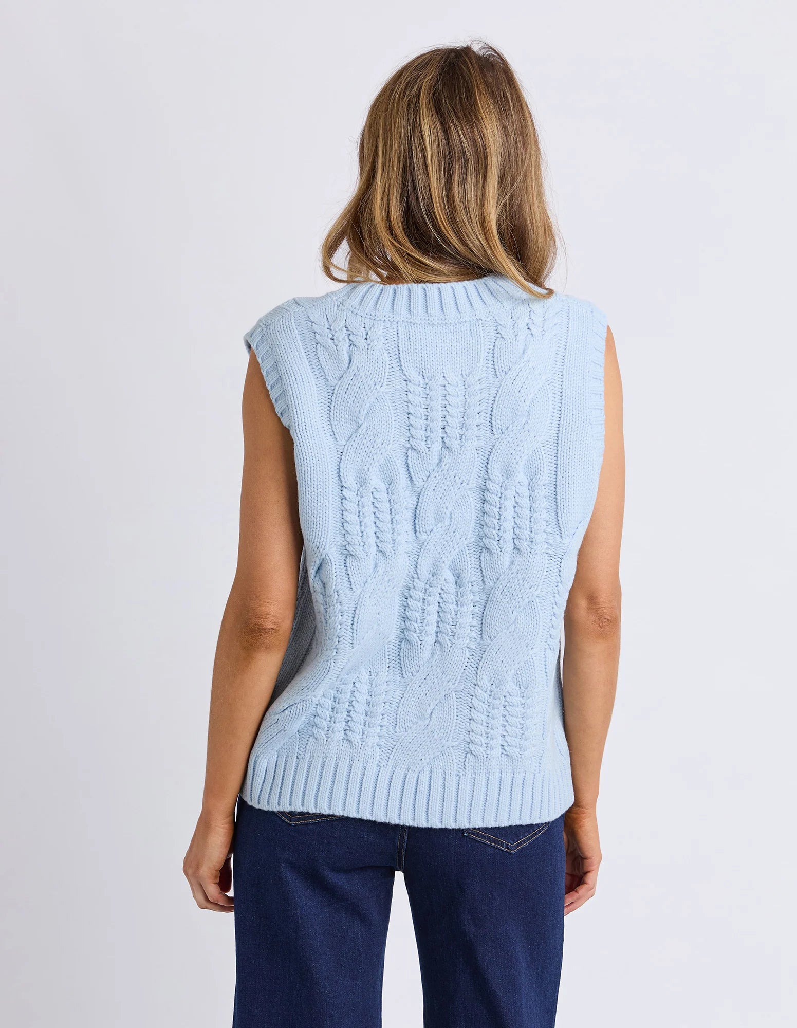 Foxwood Light blue sleeveless knitted vest worn by a woman on a white background