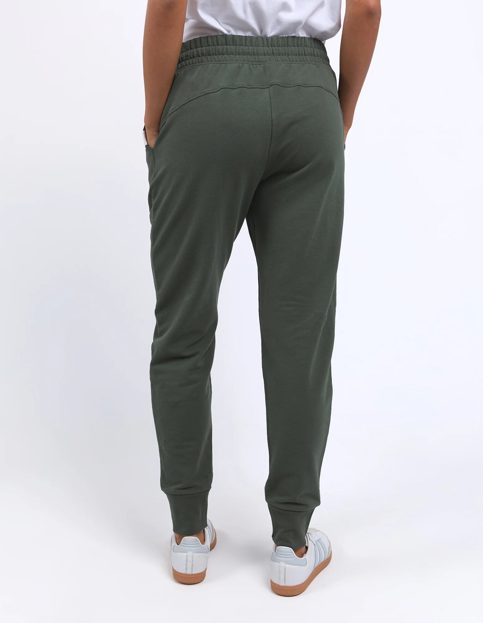 Image of Person wearing Foxwood green sweatpants on a white background