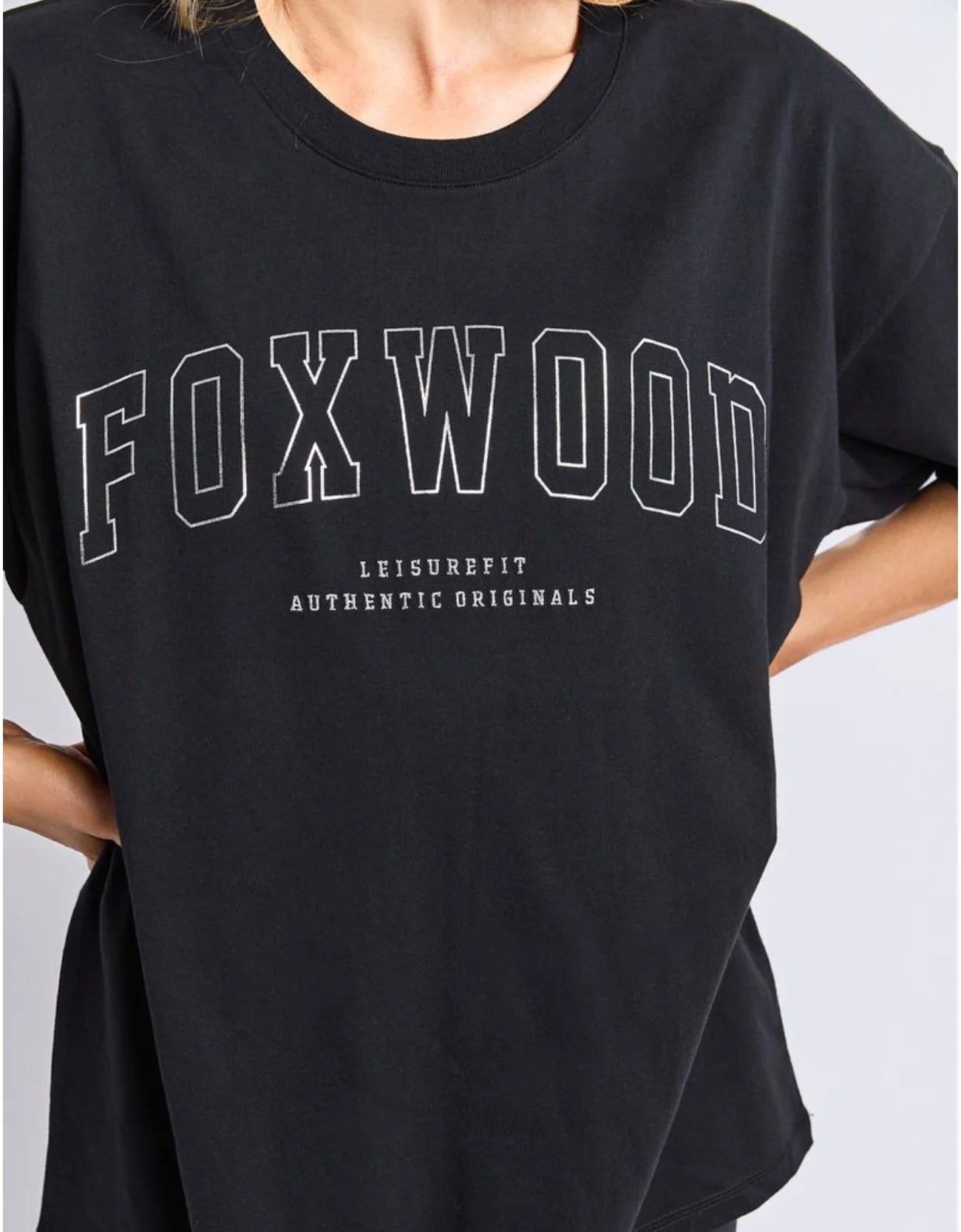 Foxwood Black t-shirt with 'FOXWOOD' printed on it against a white background