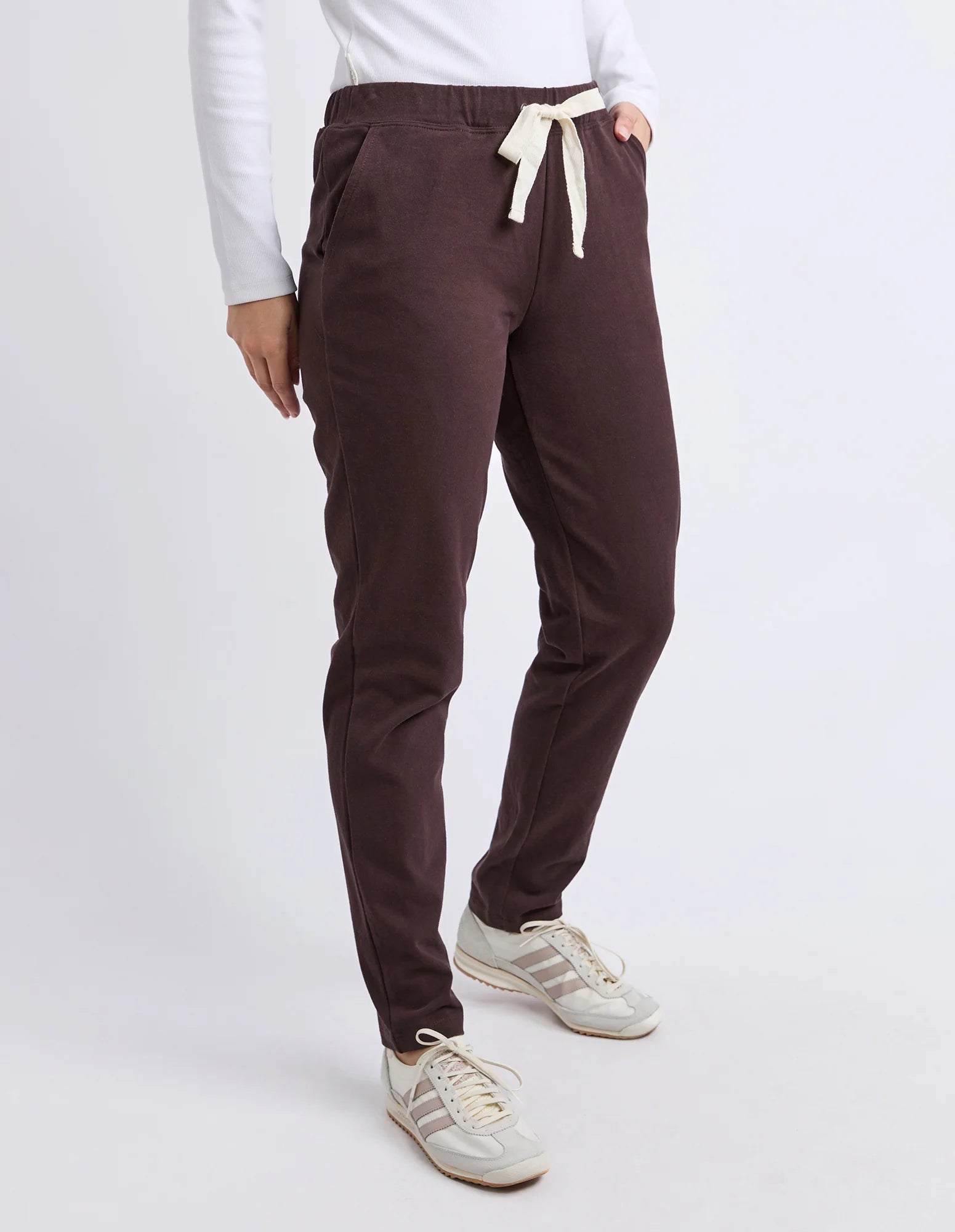 Image of Foxwood Brown pants worn by a woman on a white background