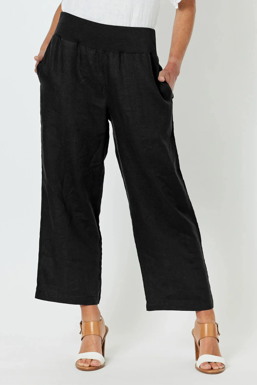 Image of Gordon Smith Black wide-leg pants worn by a woman on a white background