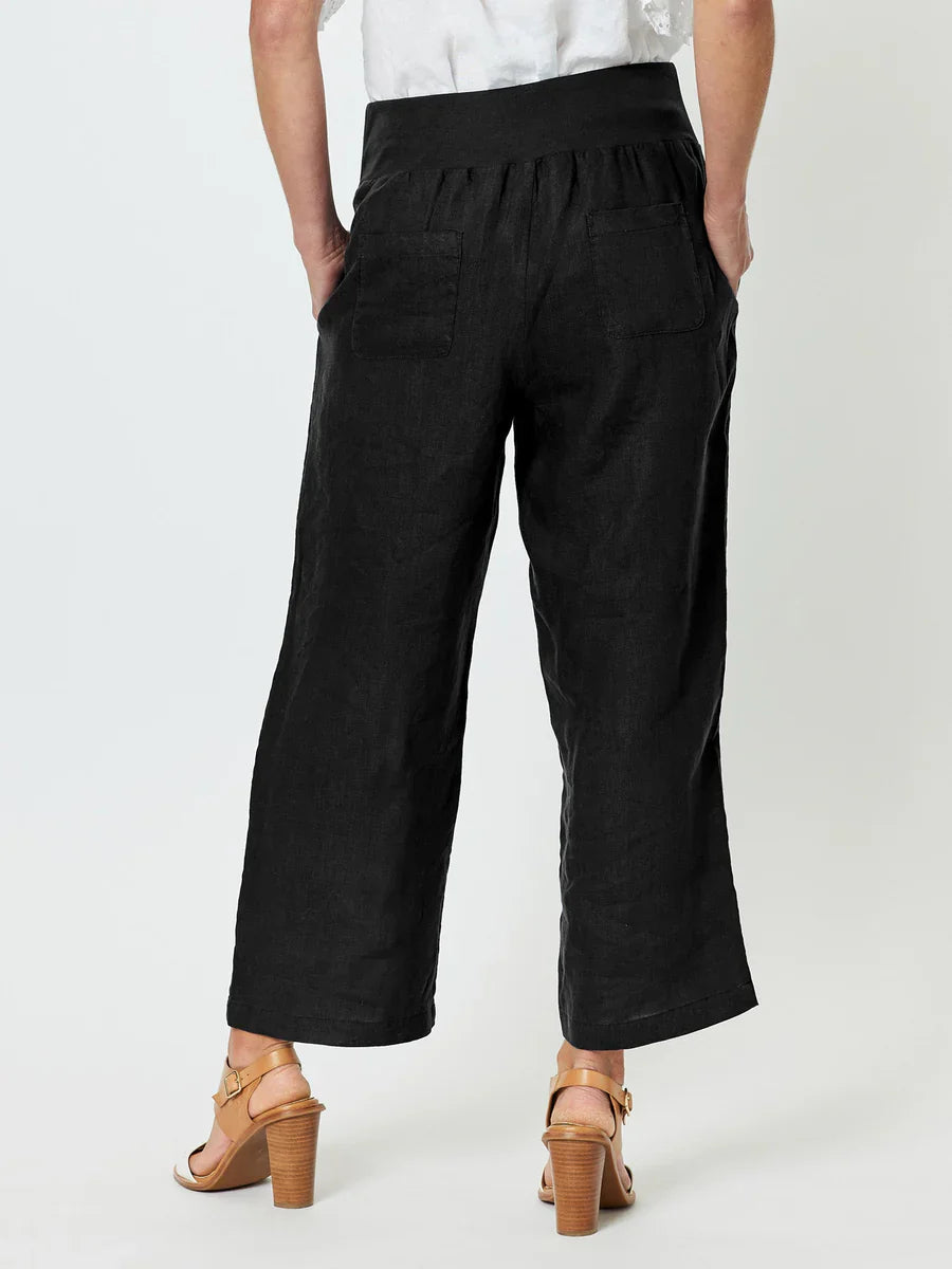 Image of Woman wearing Gordon Smith black wide-leg pants on a white background
