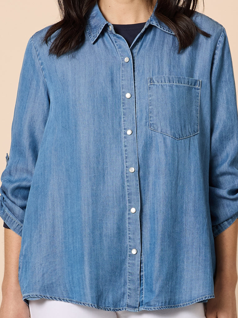 Image of Woman wearing Gordon Smith denim shirt on a beige background
