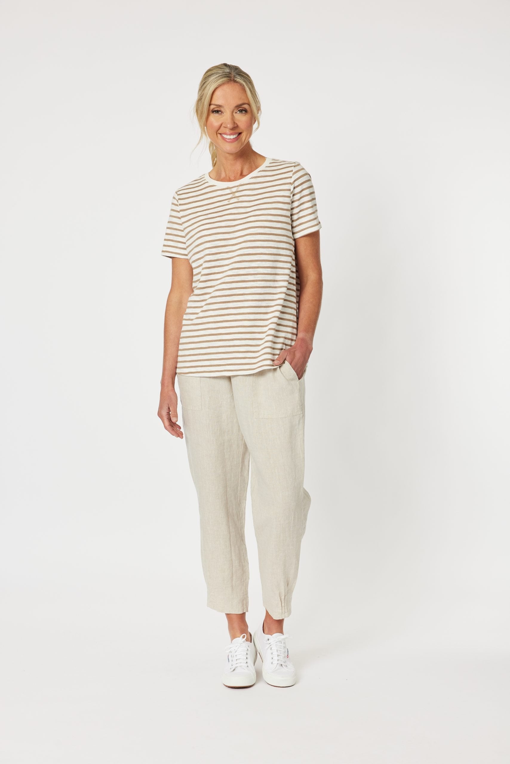 Women wearing stripe top with Gordon Smith natural pant 