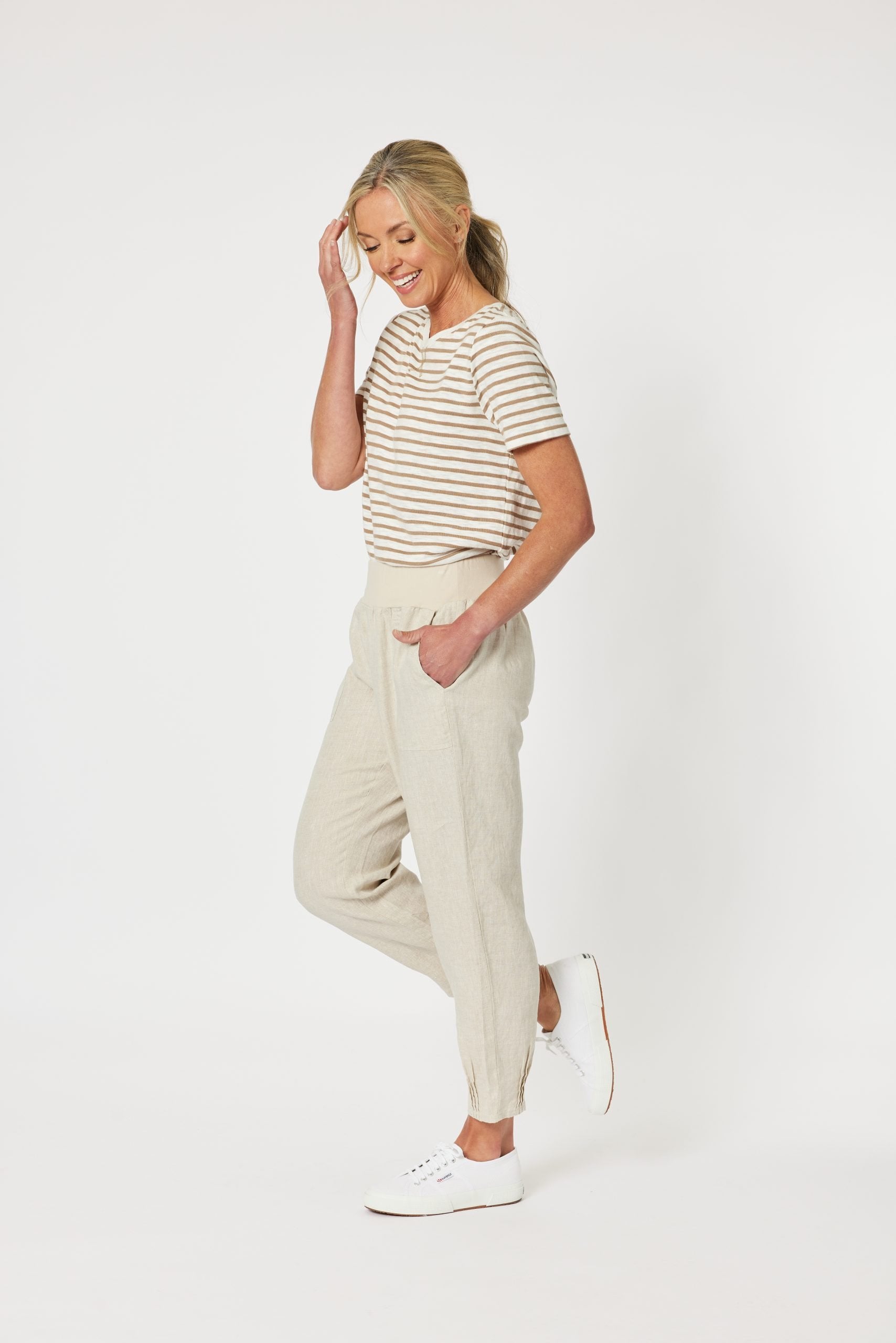 Women wearing striped top with Natural coloured Gordon Smith pants