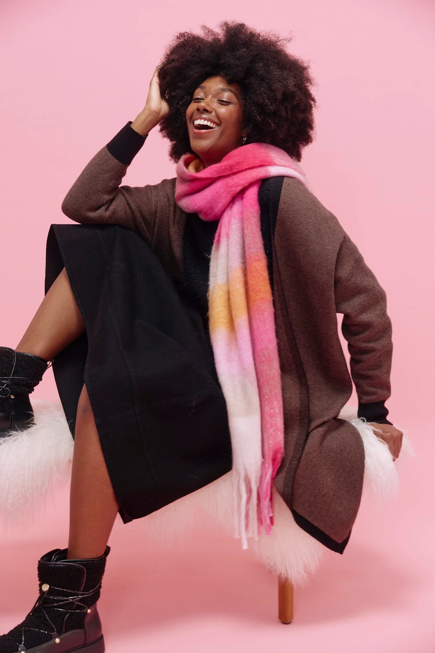 Woman wearing a Haven colorful scarf on a pink background