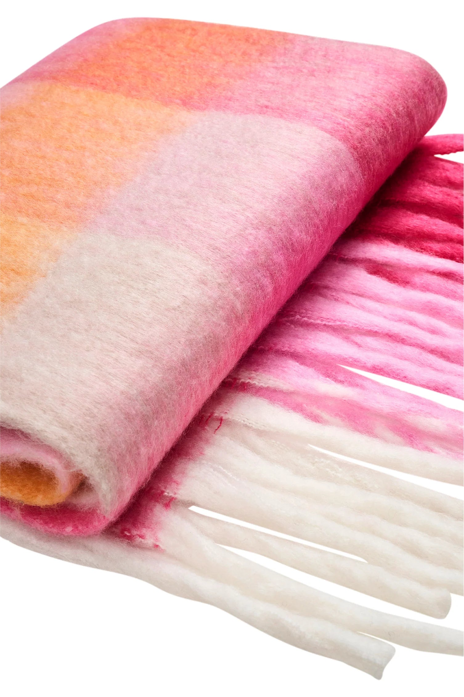 Image of Folded Haven pink and orange scarf with white fringe on a white background