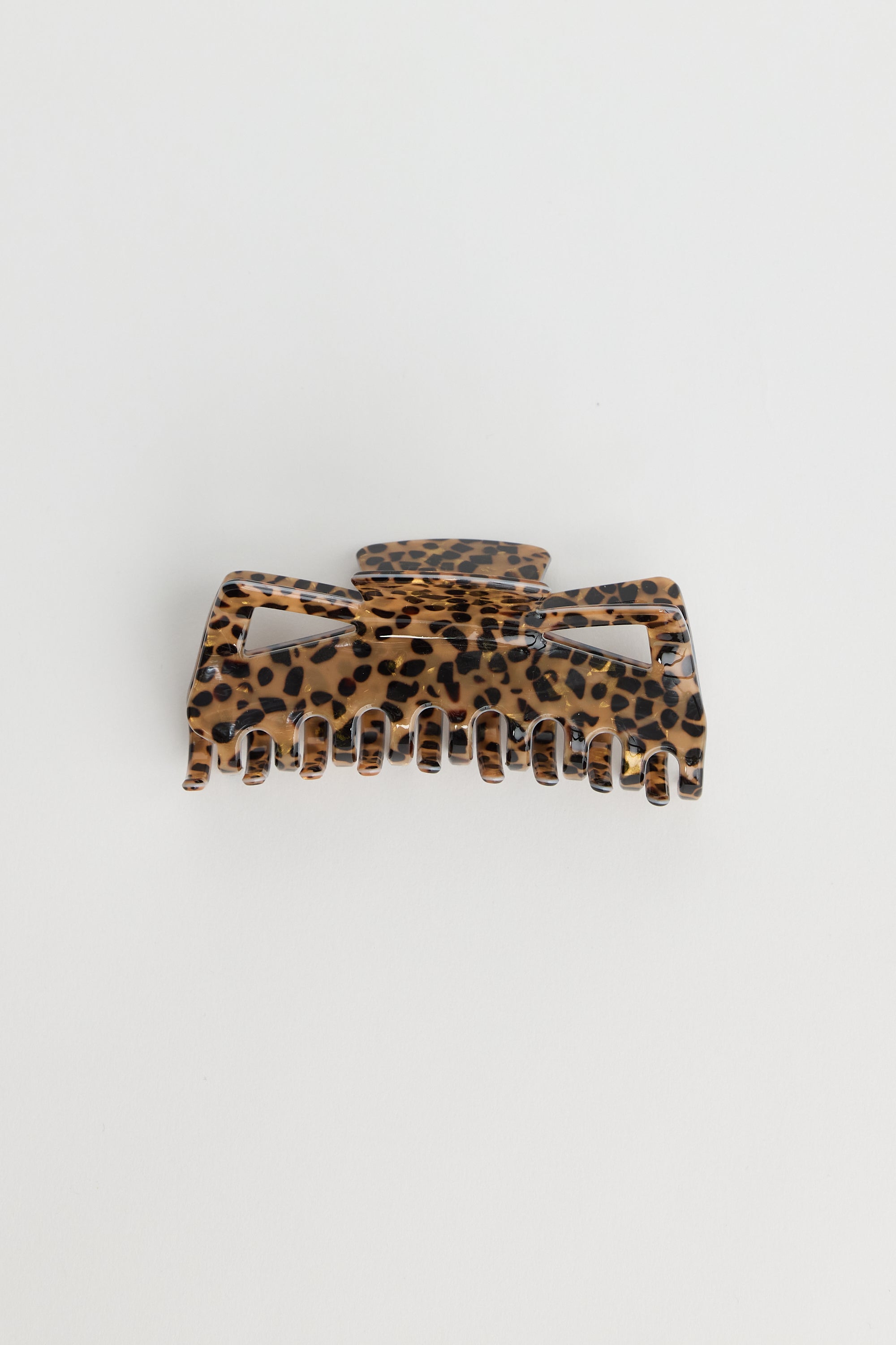 Collection of Holiday Life Leopard print hair clip on a white background in a gallery layout