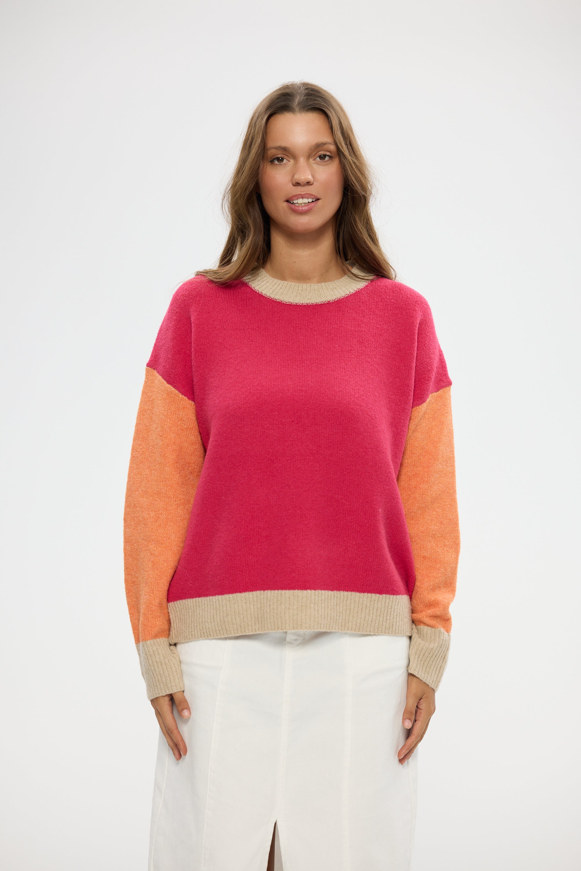 Image of Woman wearing a Holiday colorful sweater with a white background