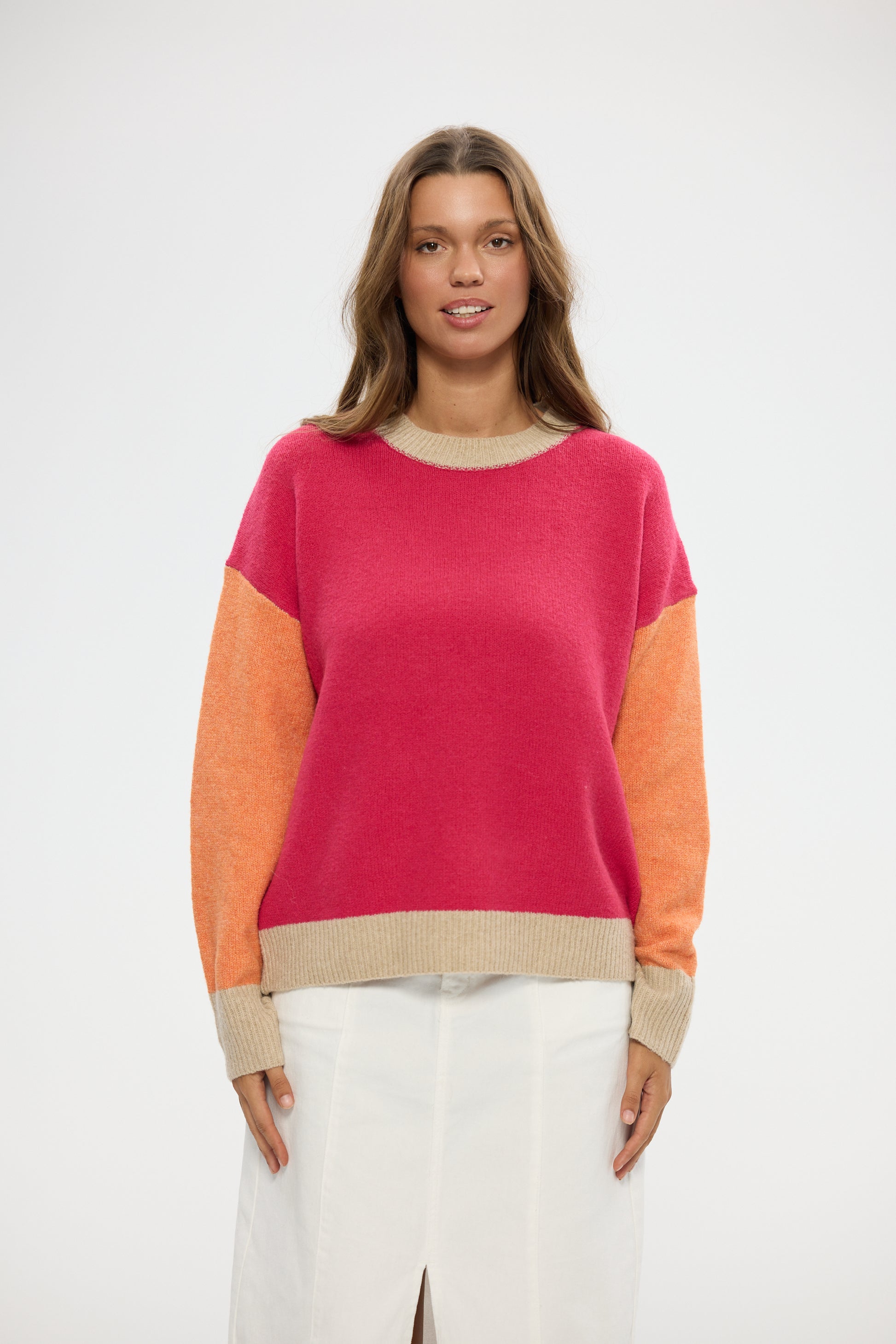 Woman wearing a Holiday colorful sweater with a white background