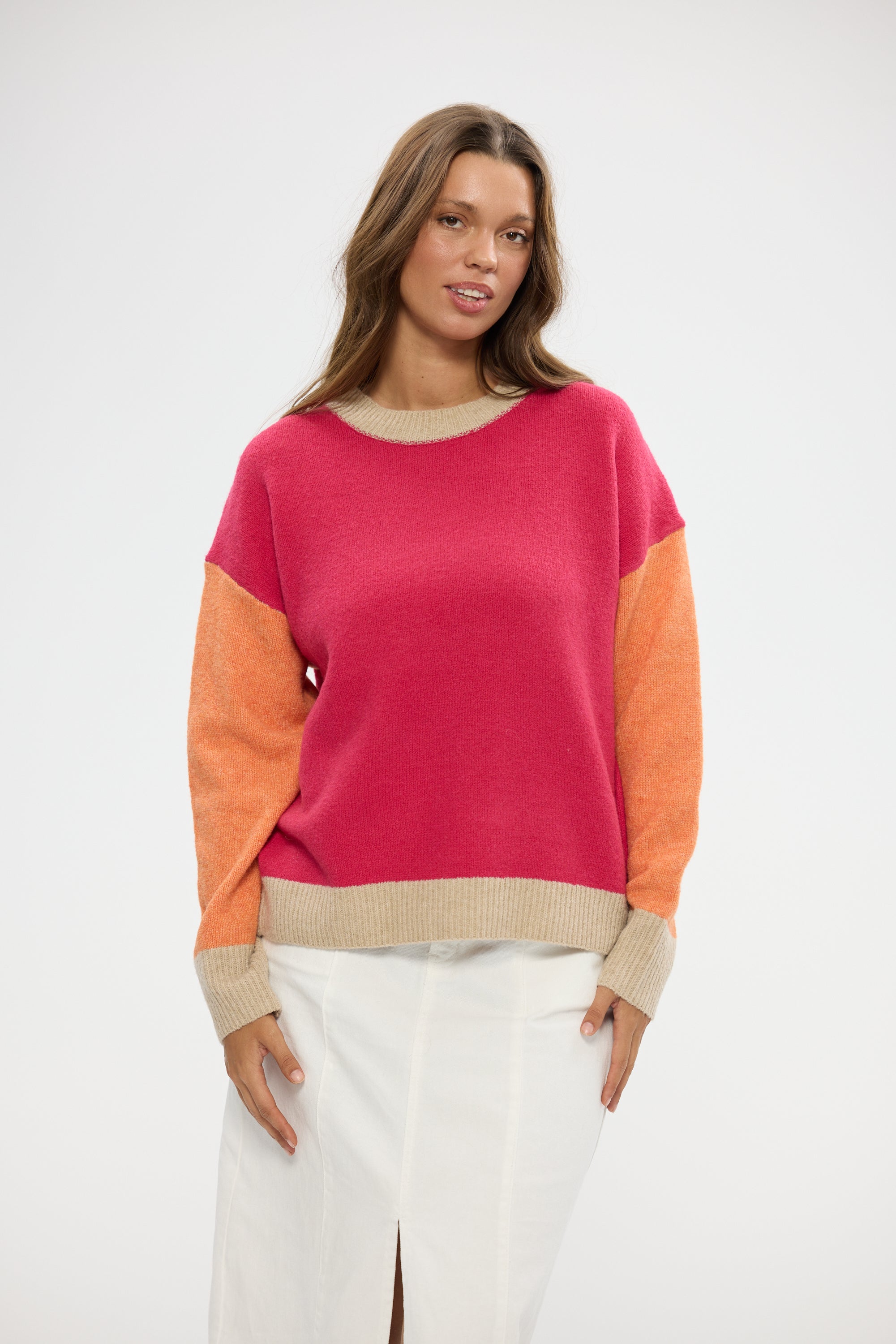Image of Woman wearing a Holiday colorful sweater with a plain background