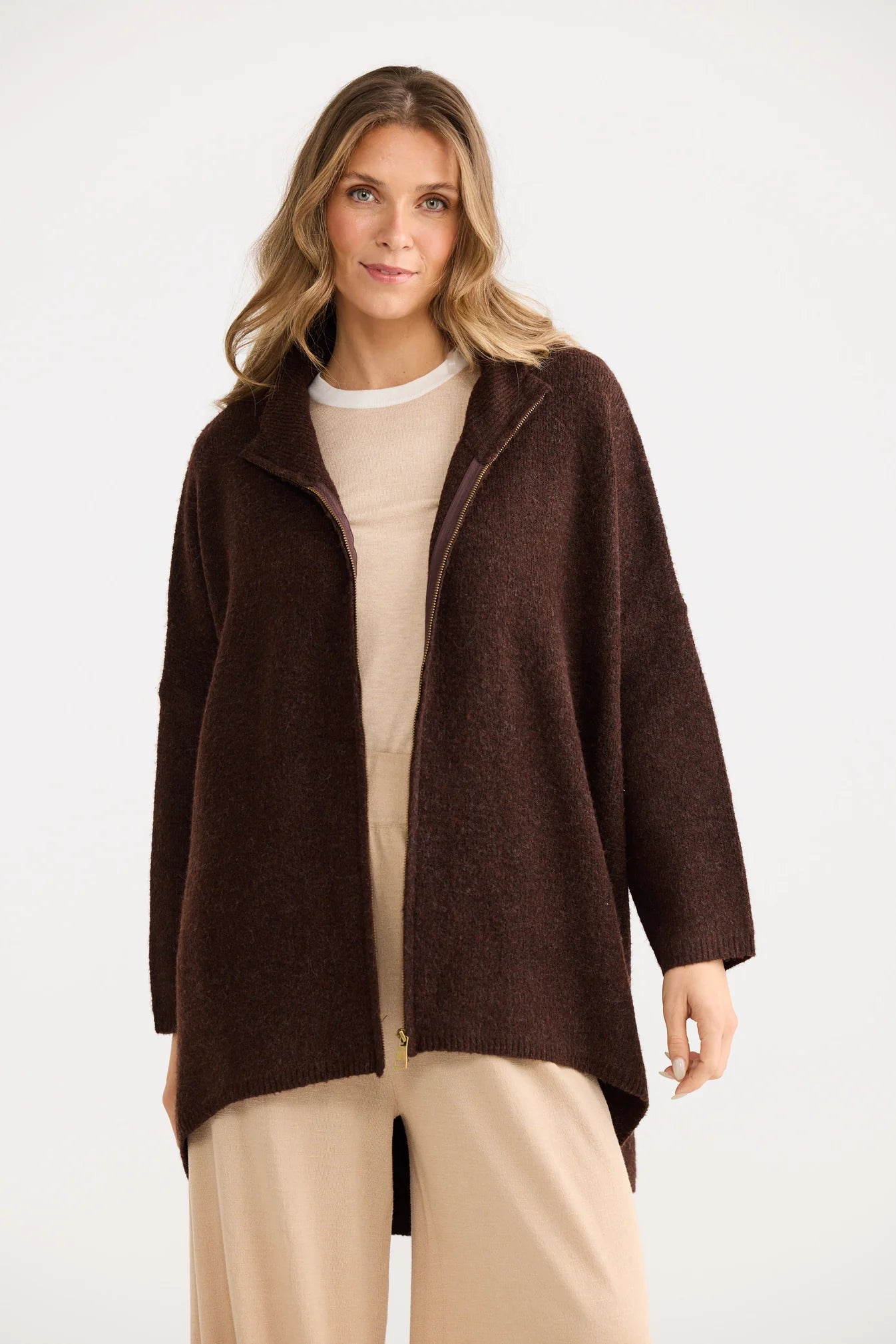 Collection of Woman wearing a Home Love brown coat on a white background in a gallery layout