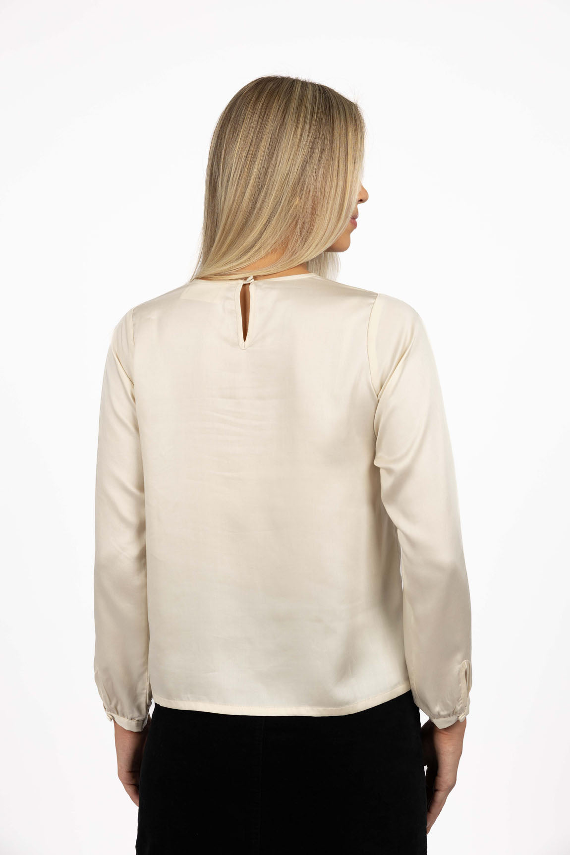 Collection of Woman wearing a Humidity beige blouse with a cut-out back design on a white background in a gallery layout