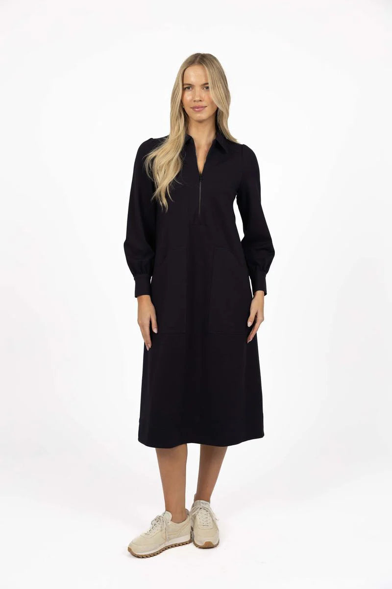 Image of Woman wearing a Humidity black dress on a white background