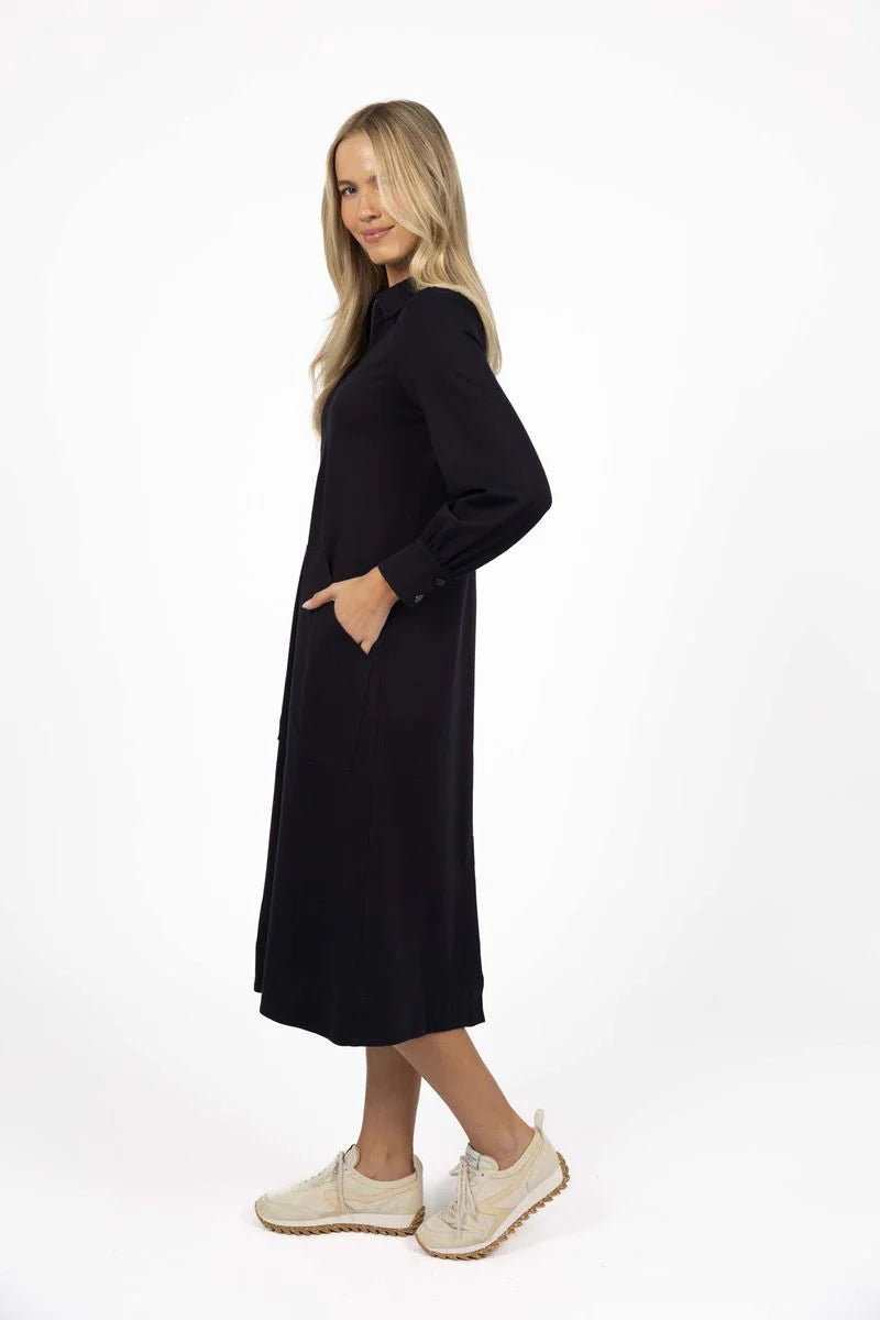 Image of Woman wearing a Humidity black dress on a white background