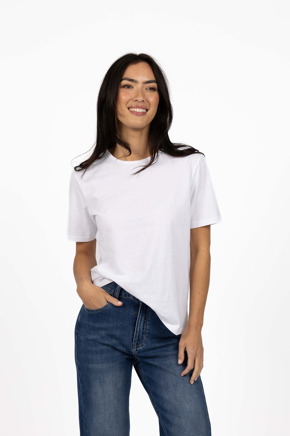 Image of Woman wearing a Humidity white t-shirt and blue jeans on a white background