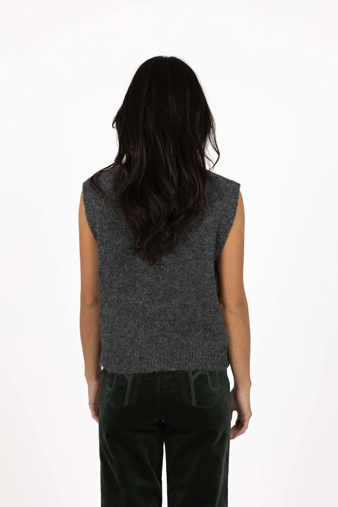 Woman wearing a Humidity grey sleeveless top with a plain white background